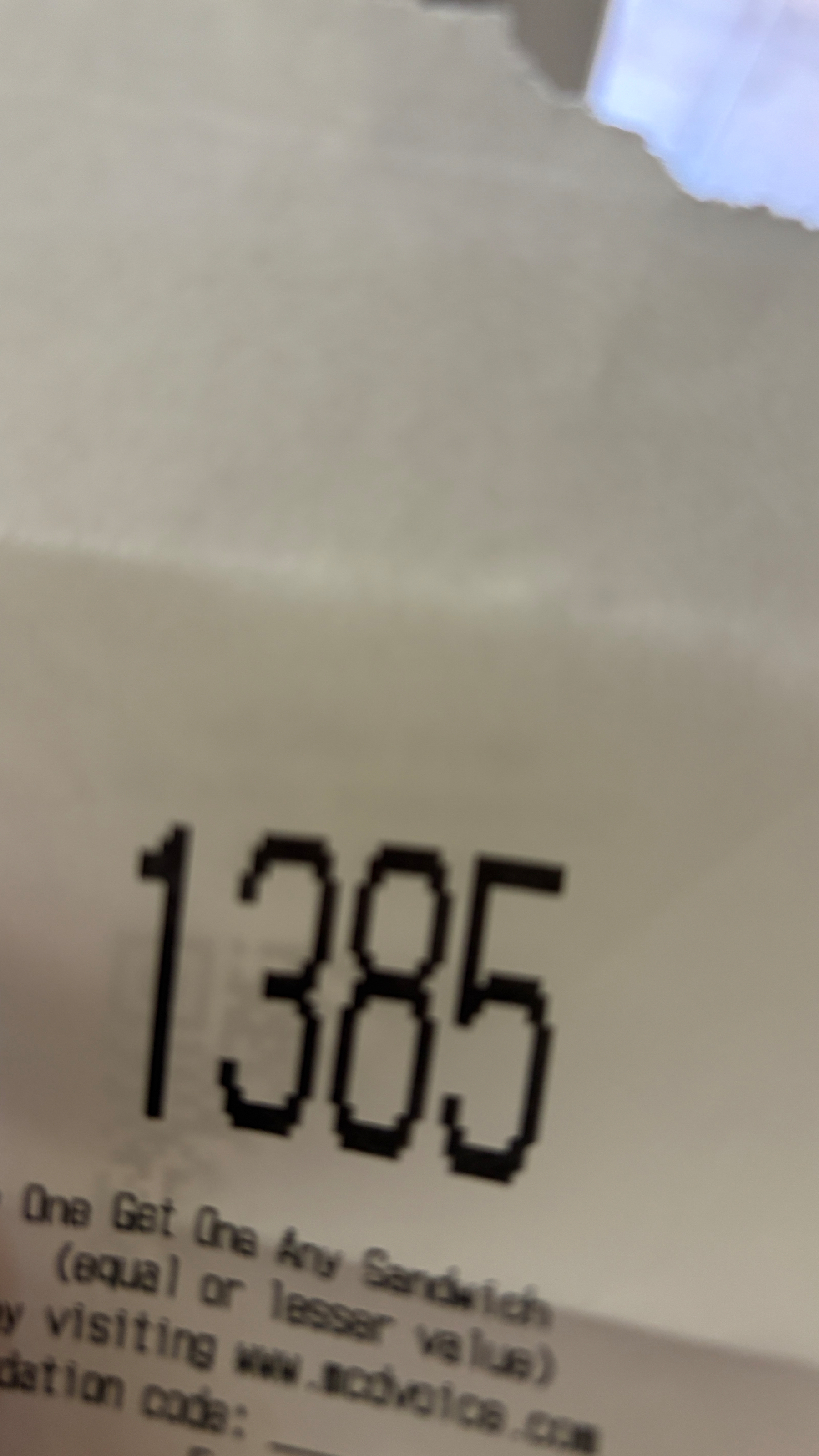 A receipt with “1385” printed in large numerals at the top