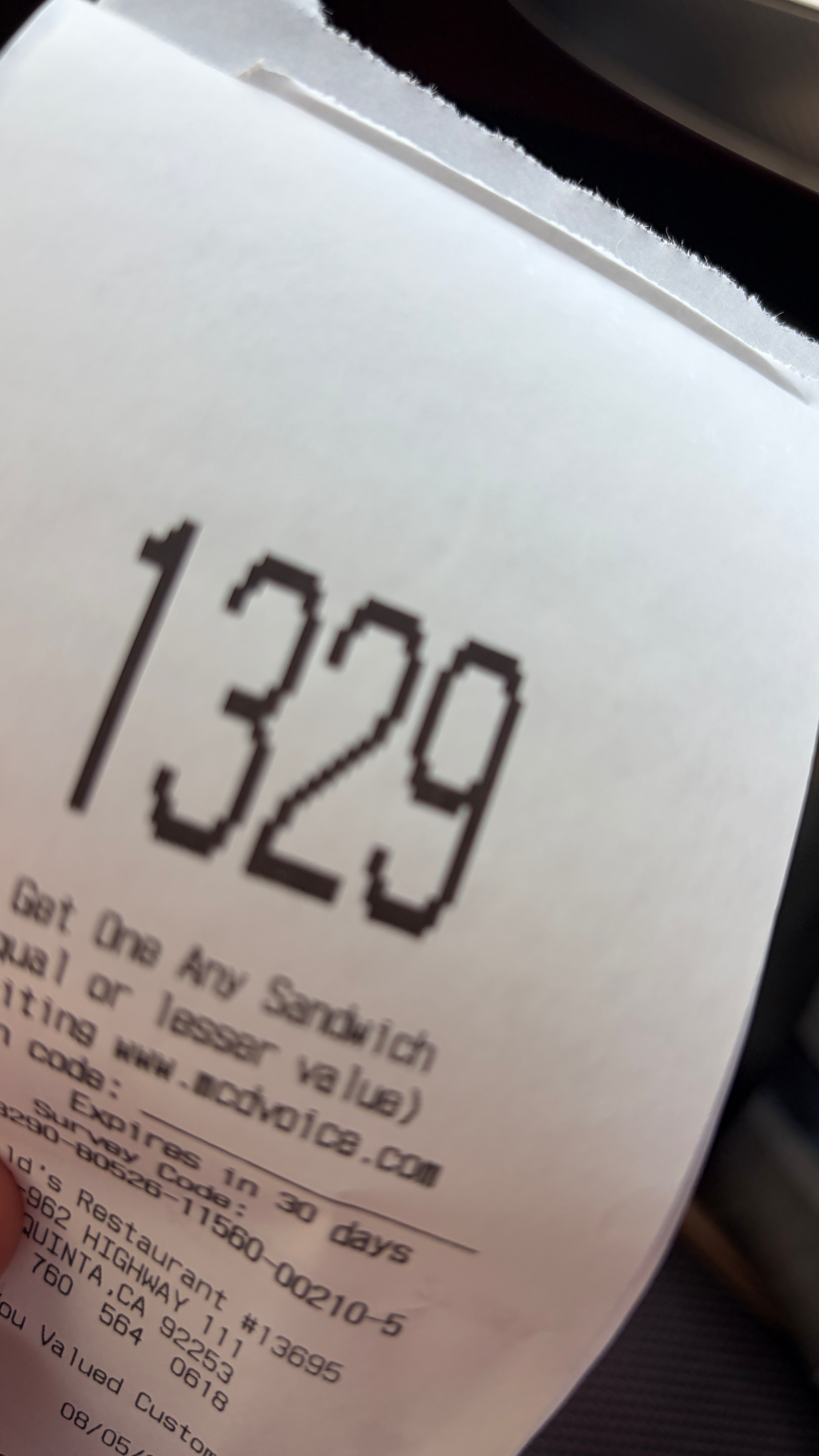 Receipt with “1329” printed in large numerals at the top