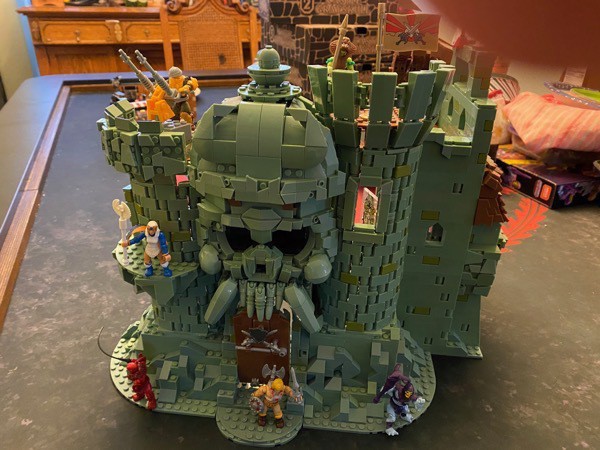The front of Castle Grayskull Mega Construx set with two towers, huge skull wall, and the jawbridge.