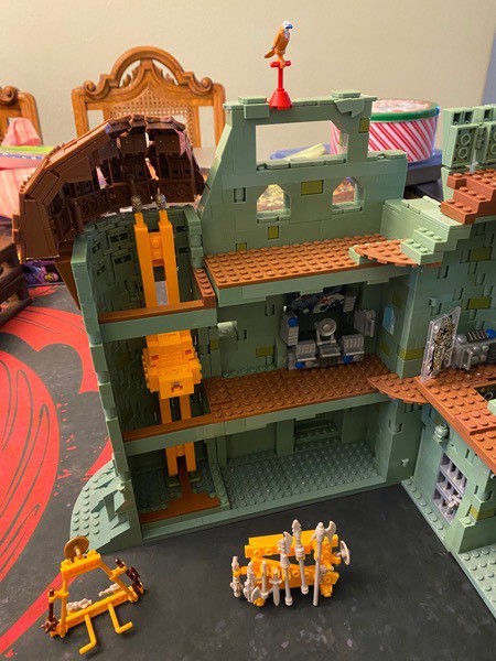 Inside the side/back wall of Castle Grayskull with computer console and working elevator.