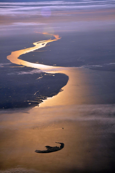 The mouth of the river Elbe, here in October 2010, marks the southeastern corner of the German Bight. The island is Trischen by Vincent van Zeijst