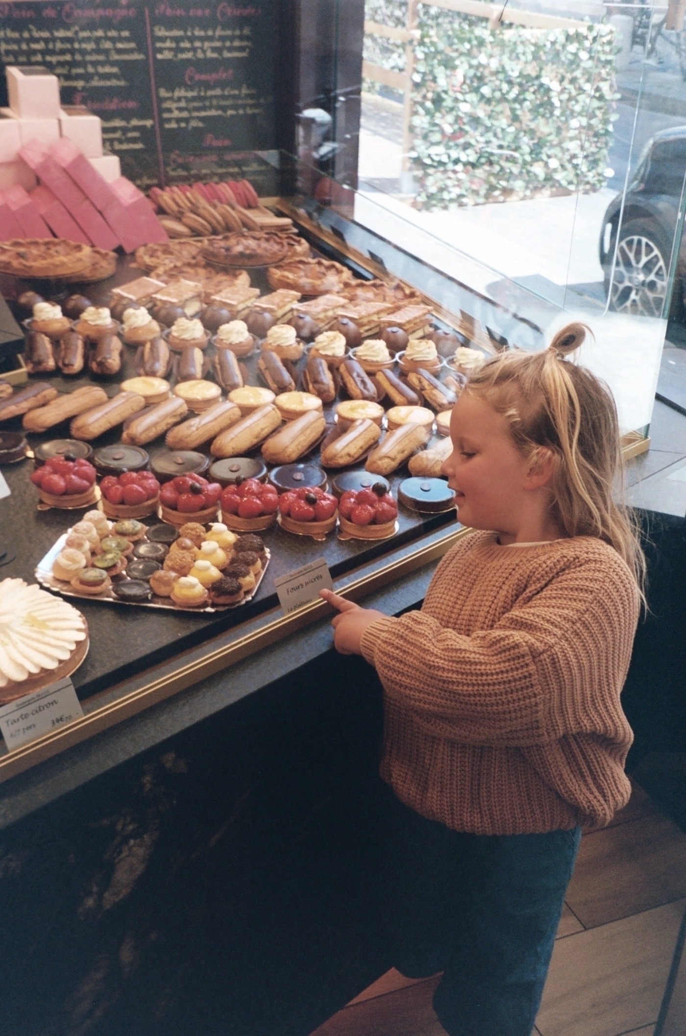 Bakery in Paris with Luna. Photo taken with Leica Z2X in Paris by Josh Withers.