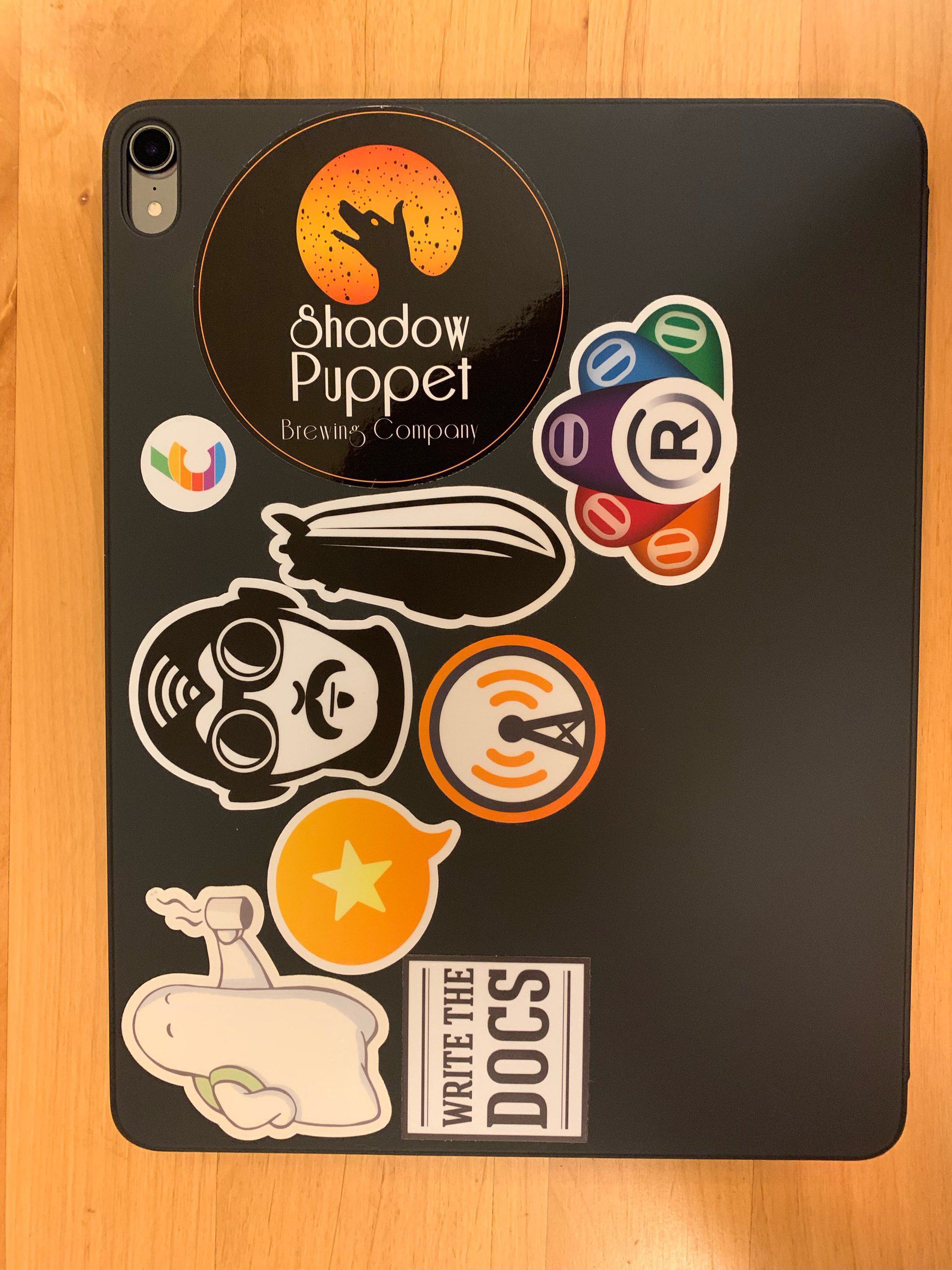 iPad Pro case partially covered with various stickers