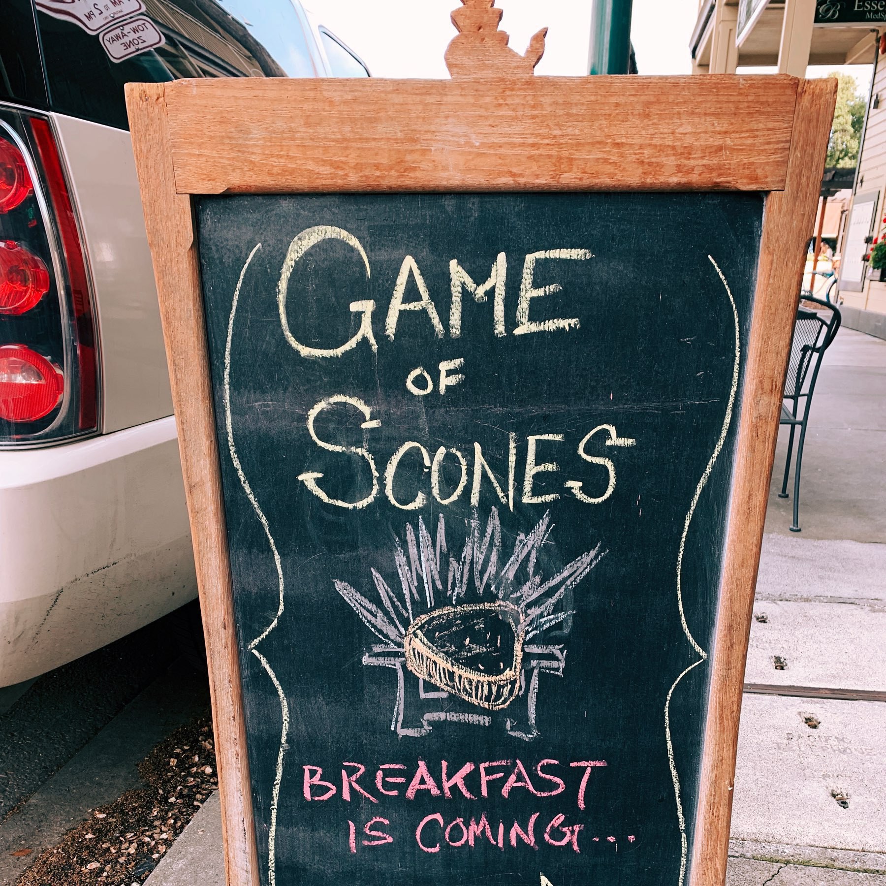 chalkboard sign reading "Game of Scones: breakfast is coming"