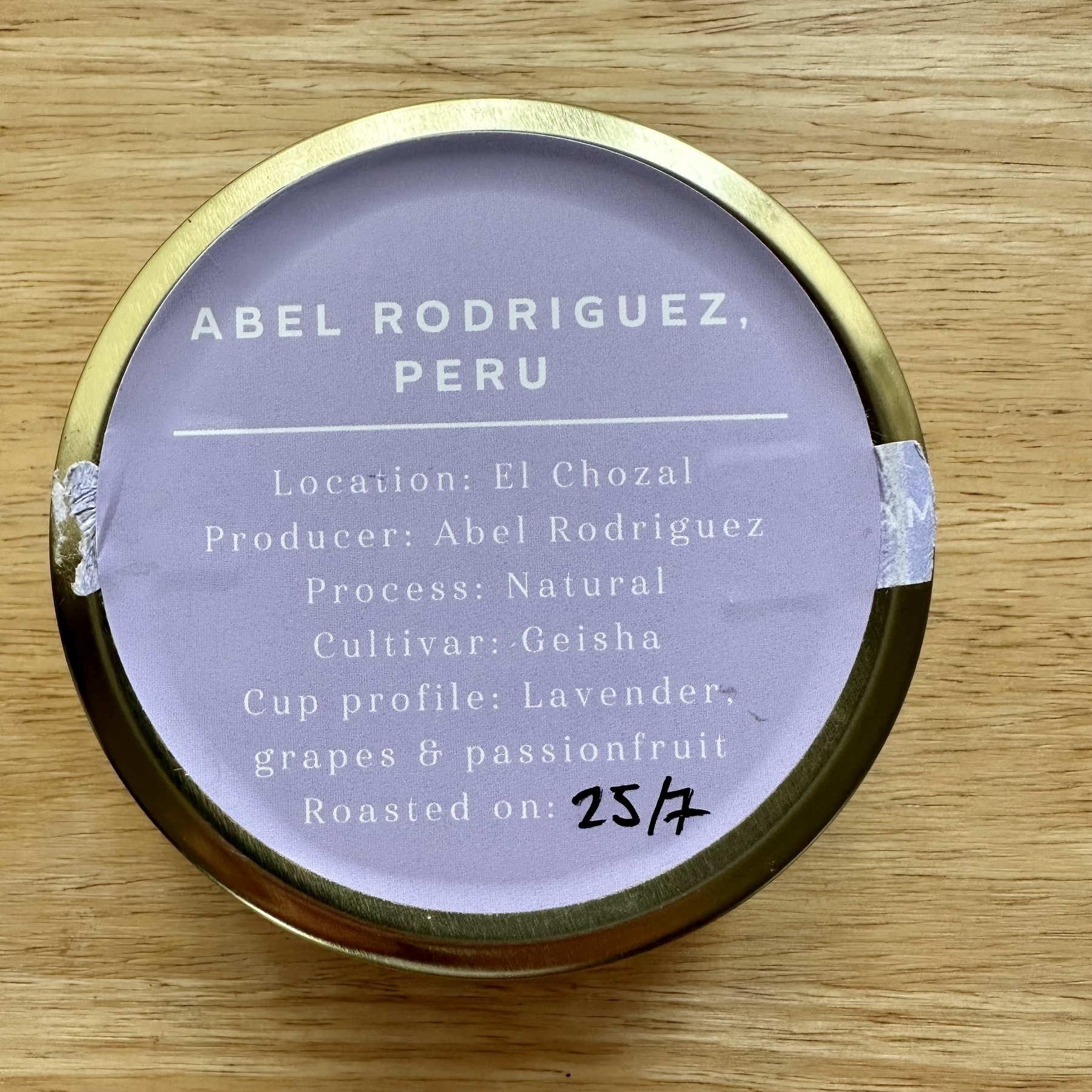 Photo of the back of a tin of limited coffee. Coffee is from Peru, a naturally processed geisha, with tasting notes of lavendar, grapes, and passion fruit.