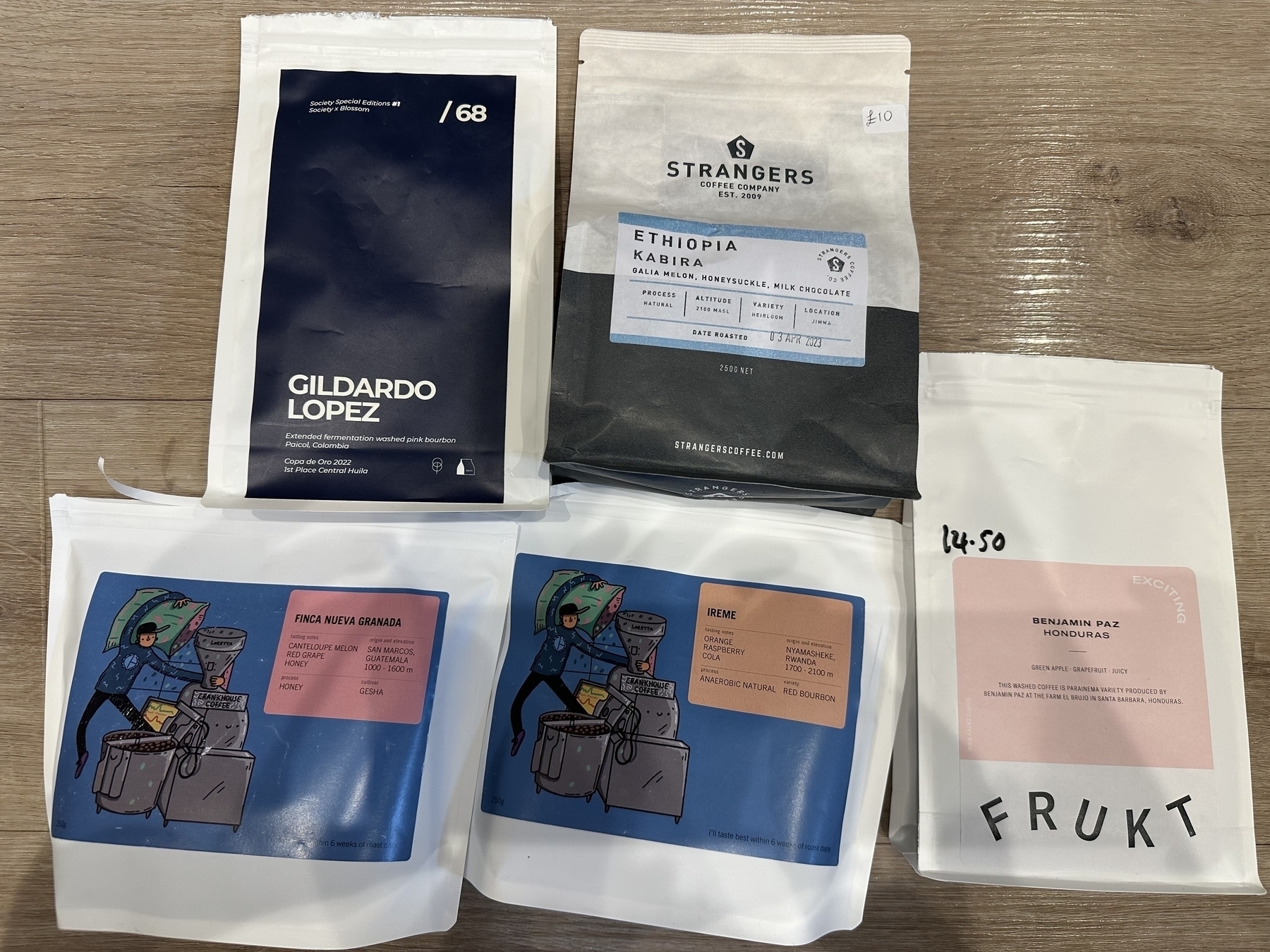 5 bags of coffee from 4 different roasters. 2 with funky illustrated labels.