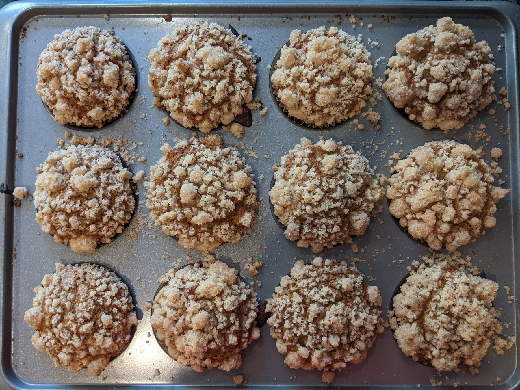 Tracy of pumpkin muffins with gold streusel topping from above 