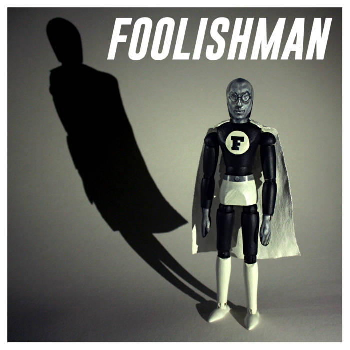 album cover showing a superhero figure casting a long deep shadow 