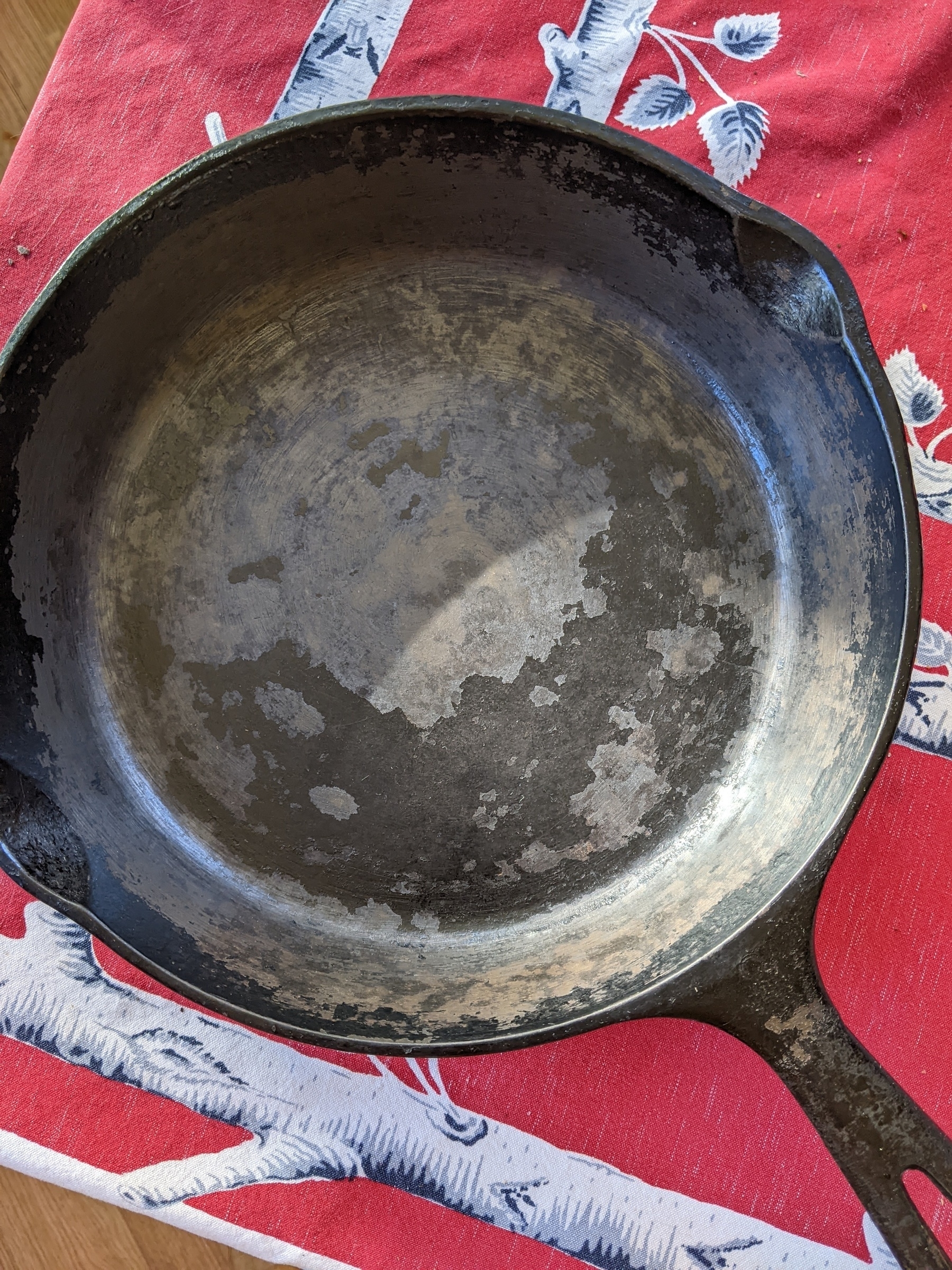 Stripped cast iron pan with flaking black finish