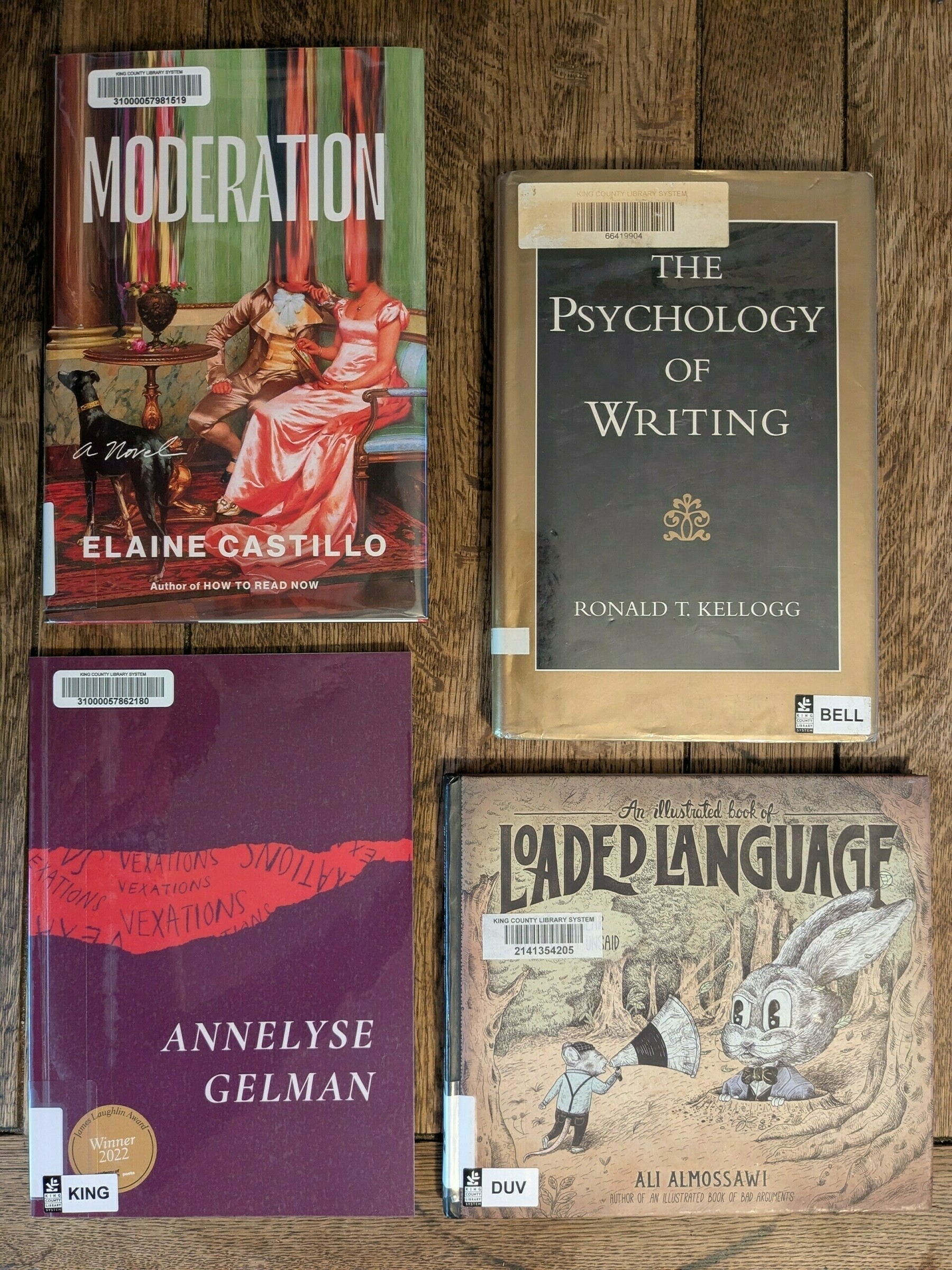 four book flatlay with one fiction, one poetry and two writing books