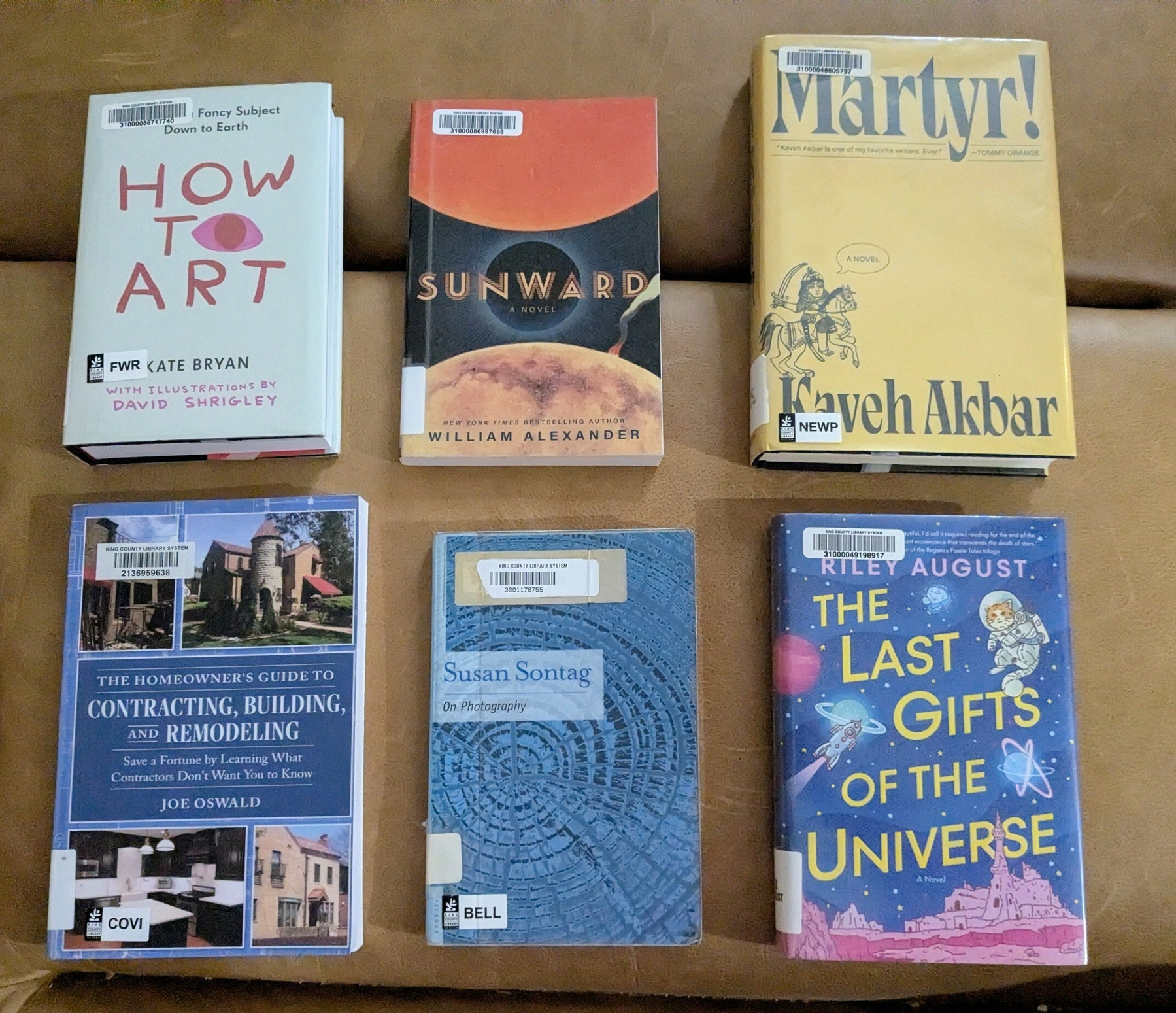 flatlay of six library books 