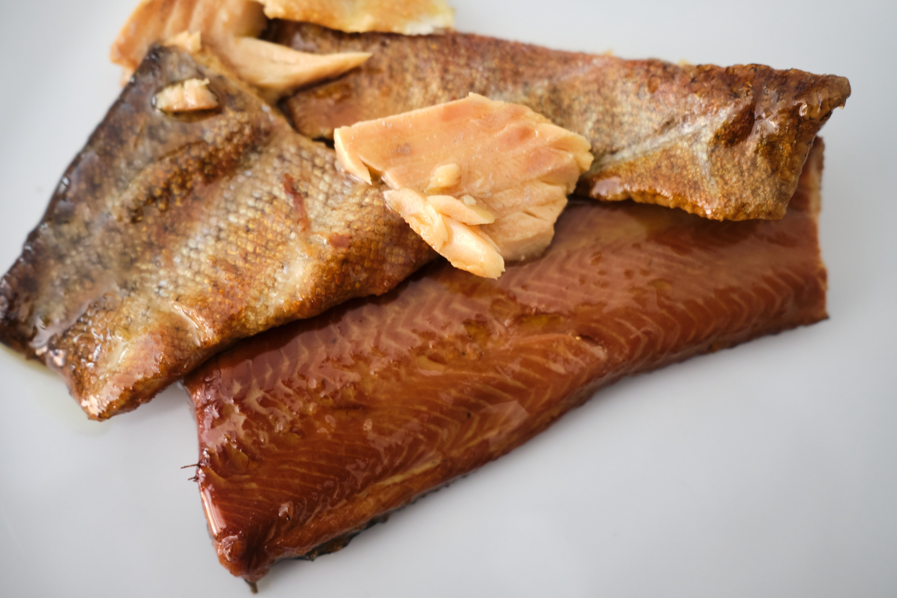 Plated filets of Jose Gourmet smoked trout, showing the flavors and textures up close. 