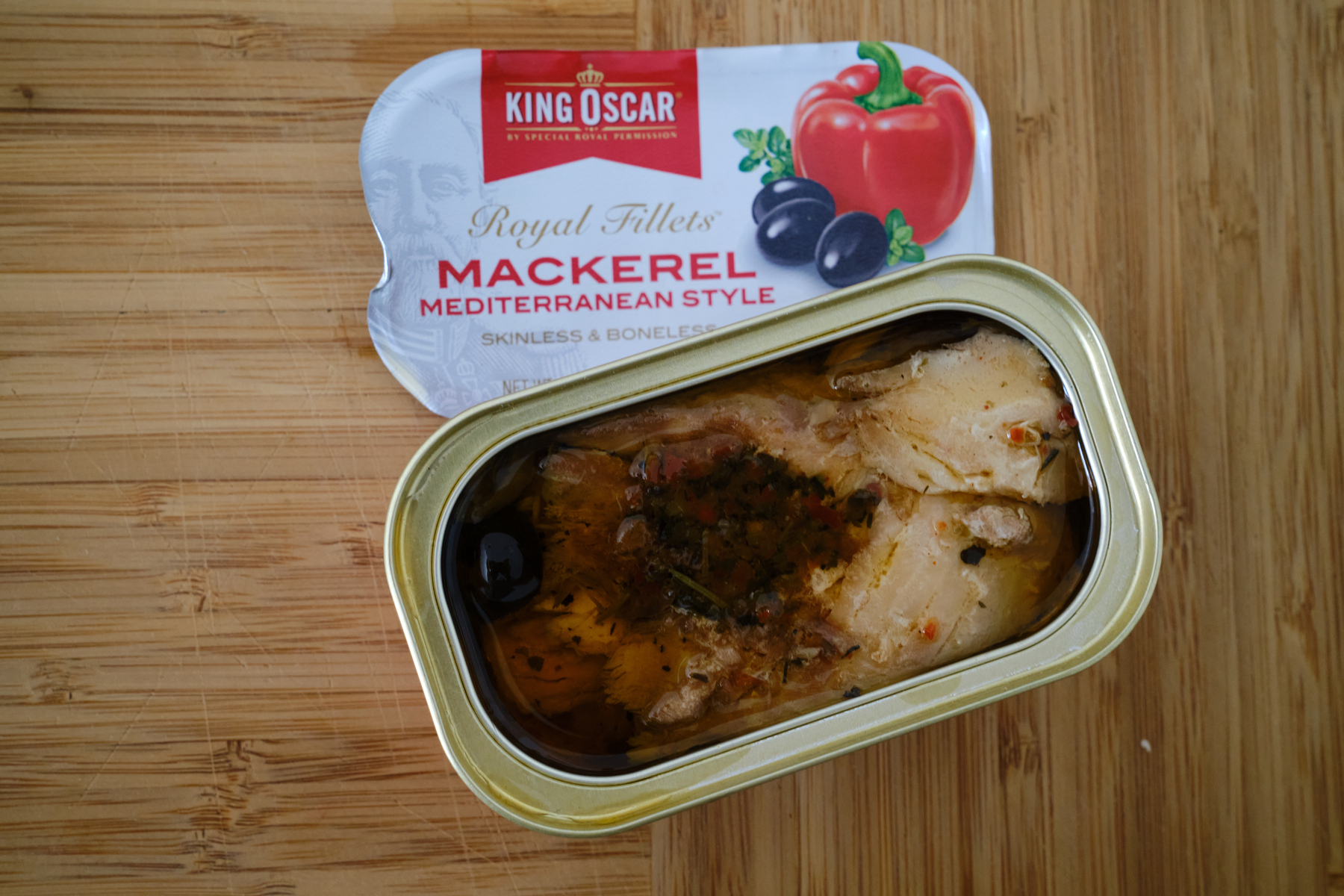 A top down look into a freshly opened can of King Oscar Mediterranean Style Mackerel filets. 