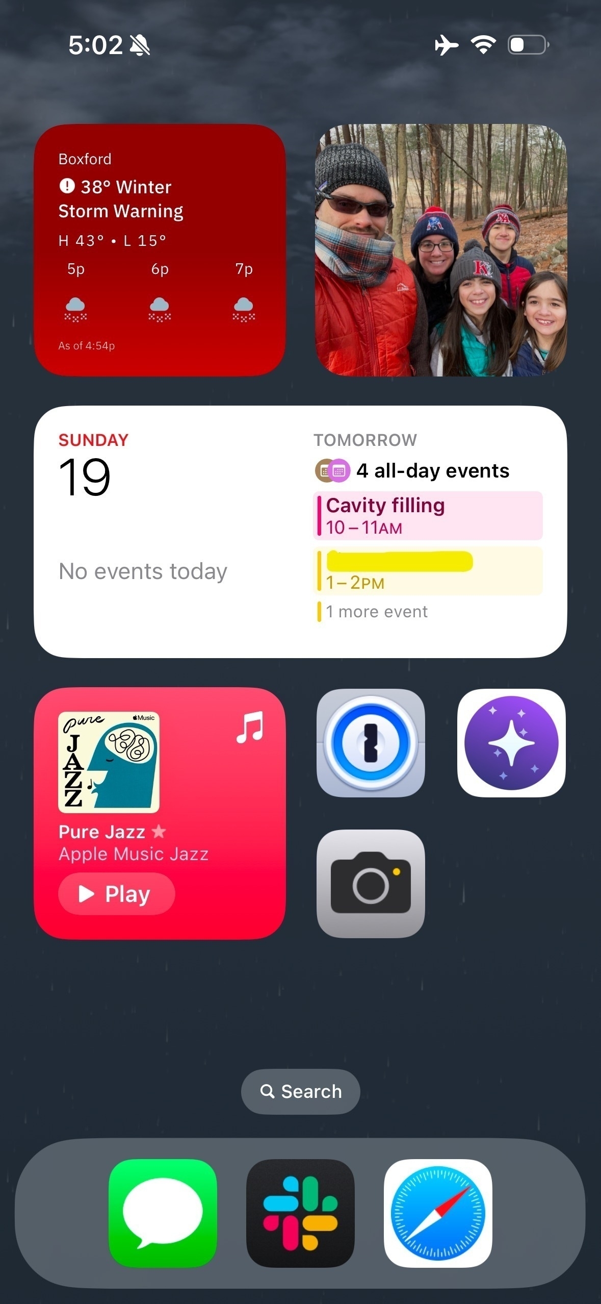 An image of an iPhone home screen running iOS 18.2.1, with widgets accounting for much of the space available.