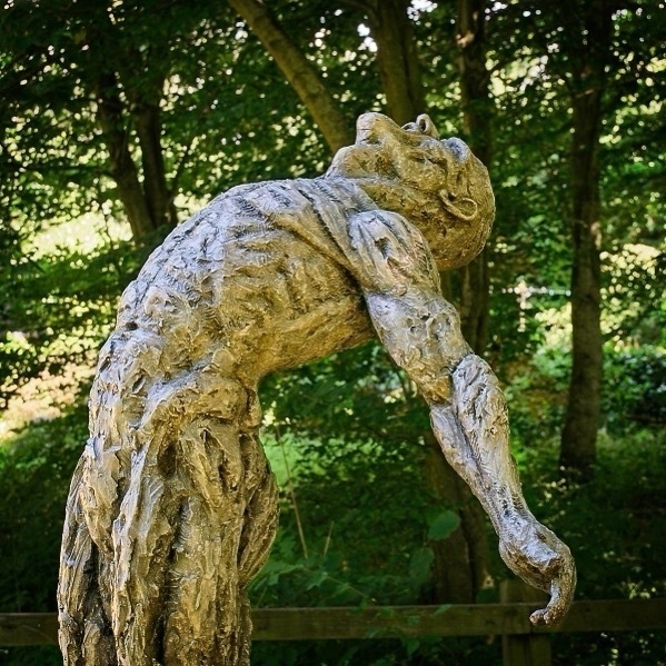 a photo of a male sculpture in a rapturous pose