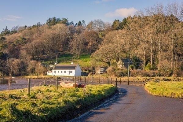 a photo of a road leading to the estuary