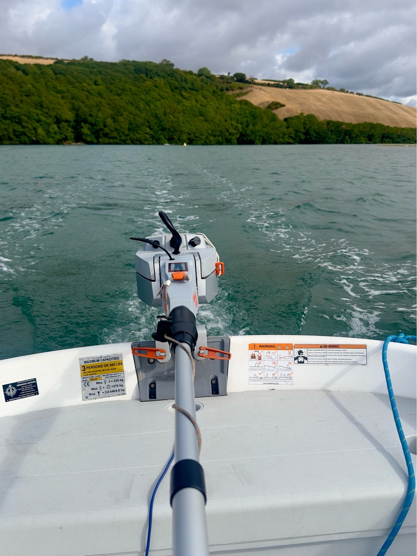 View of an outboard motor on the Avon near Aveton Gifford, Devon