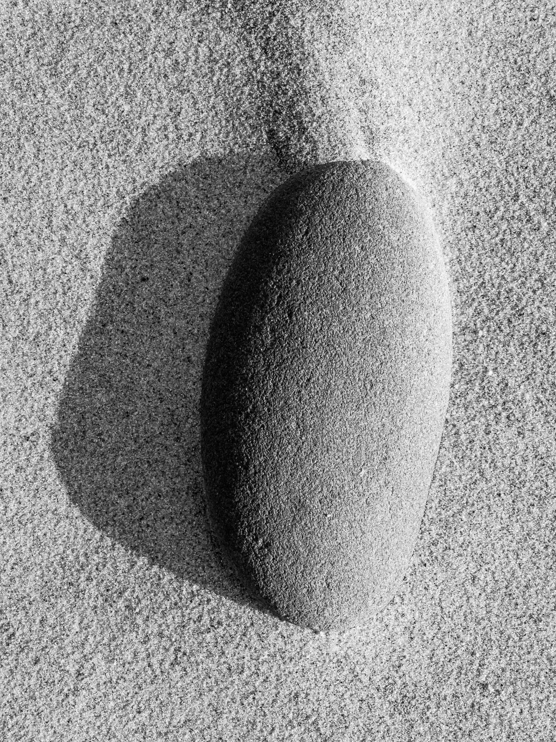 Stone and wind swept sand.