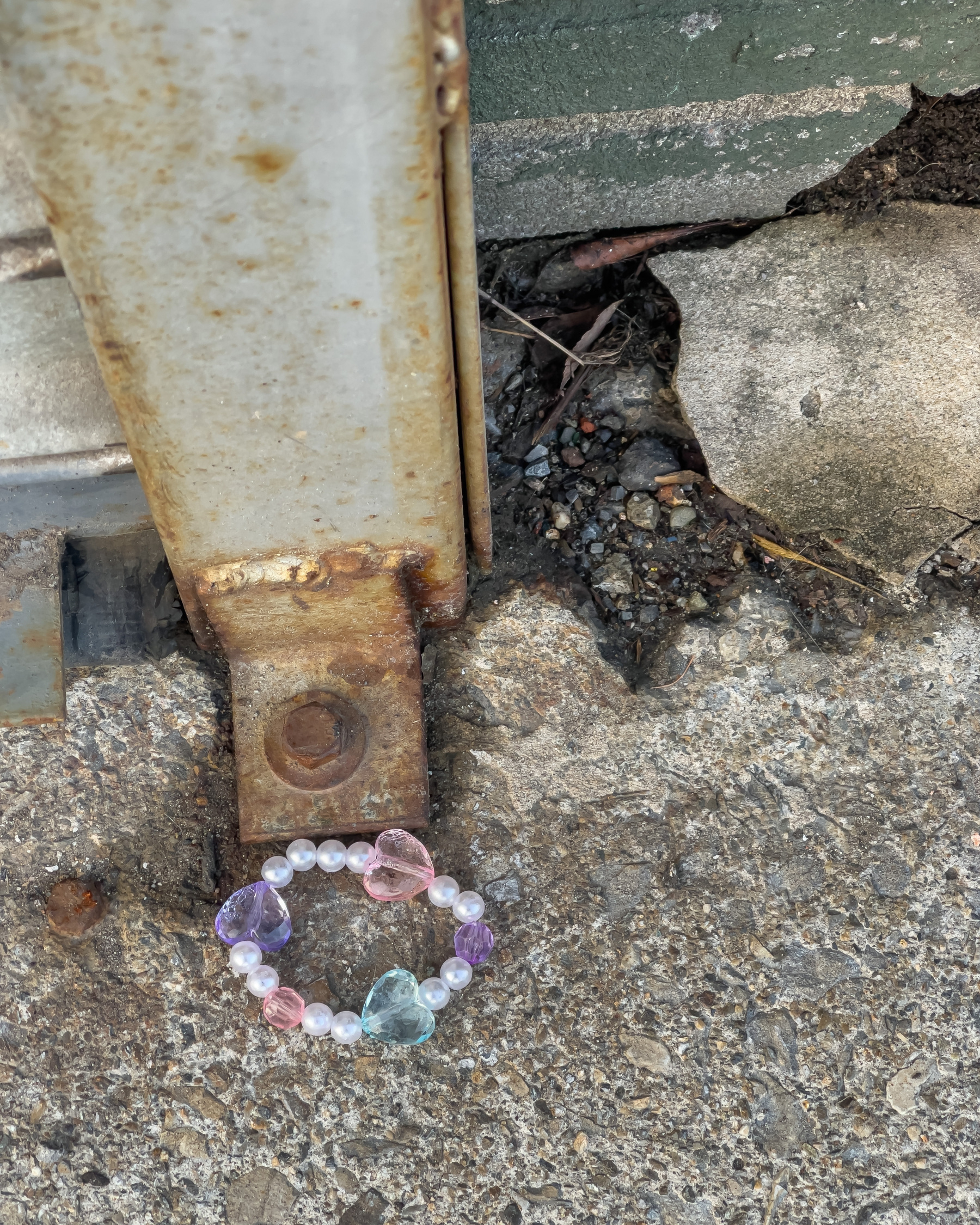 Child’s bracelet on the ground.