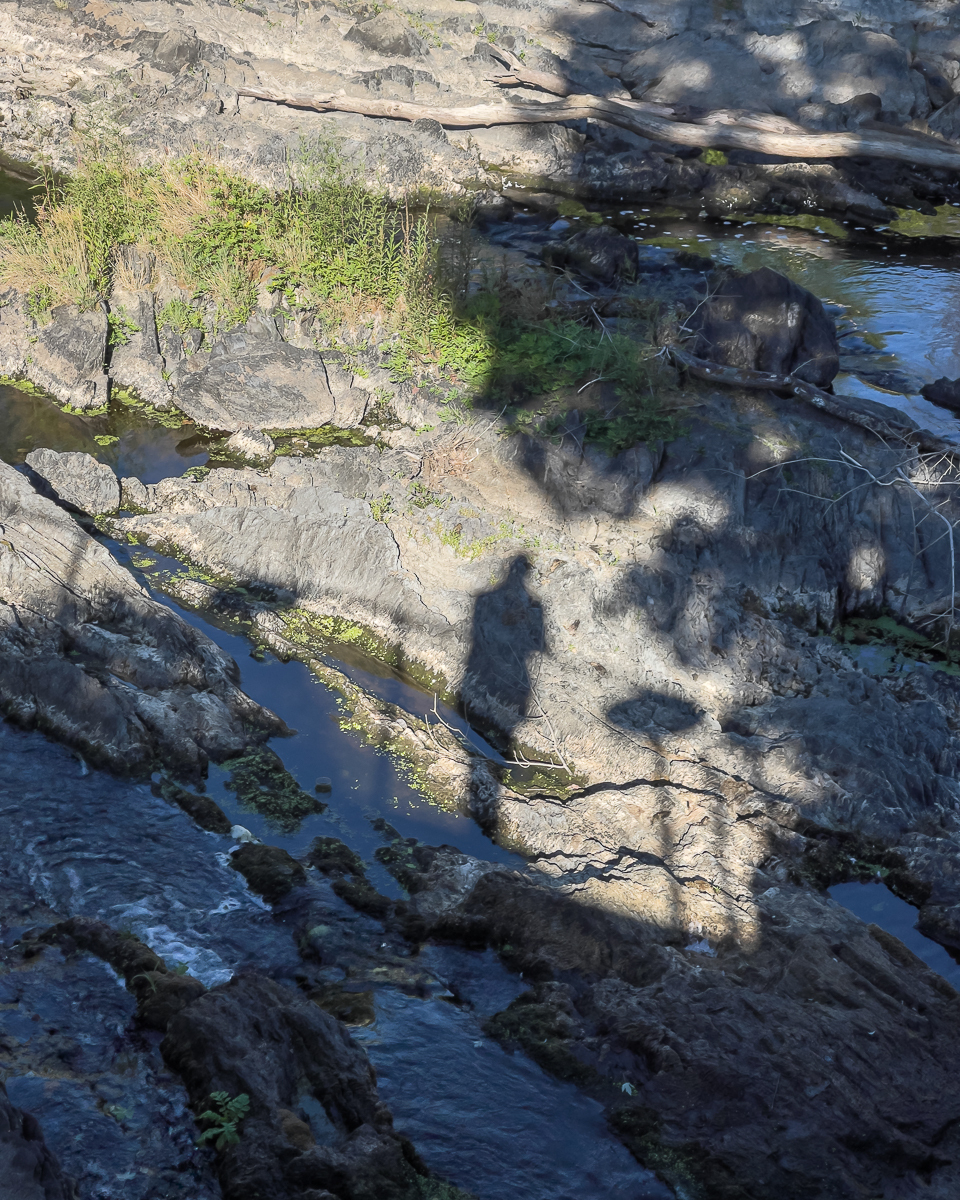 Shadow of Man and Table on Rocky Landscape