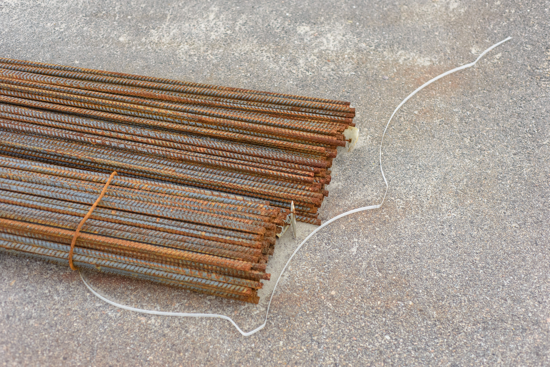 Reinforcing bars and plastic binding strap.