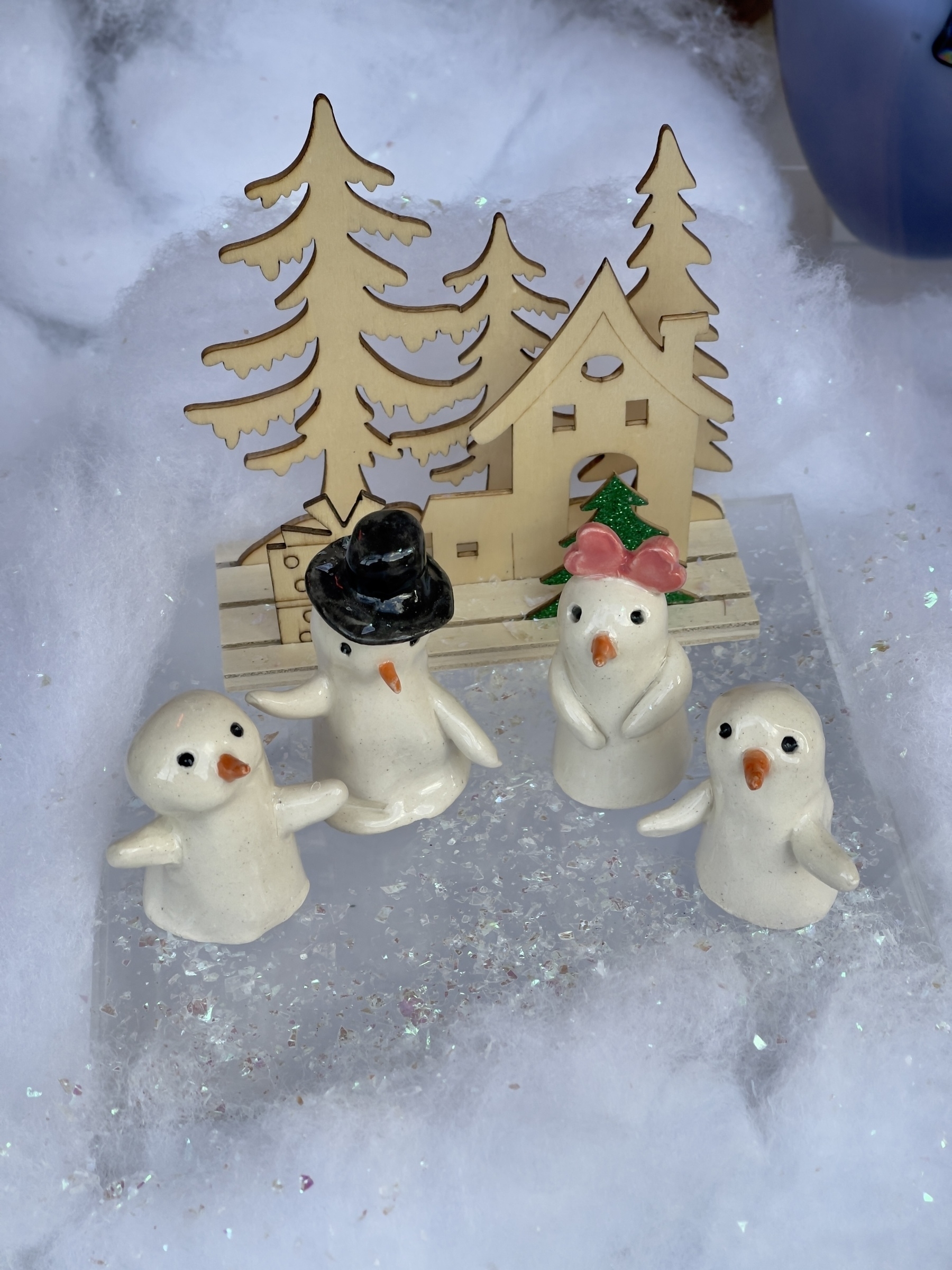 Holiday scene, ceramic penguins.