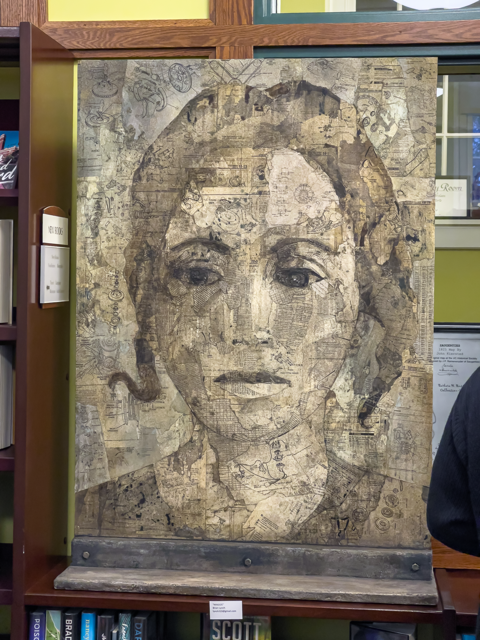 Collage portrait of a woman made with pieces of the pages of a book.