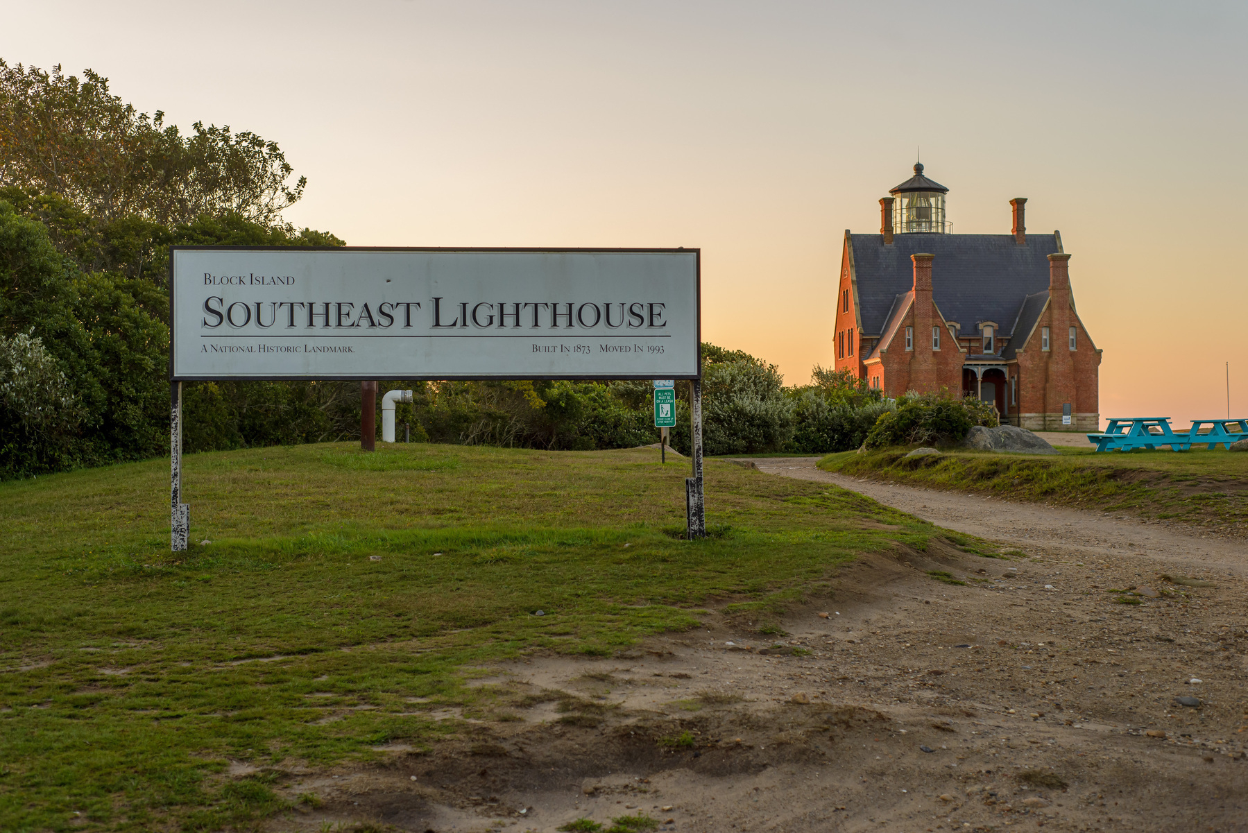 Landscape. Southeast Lighthouse sign with lighthouse in distance.