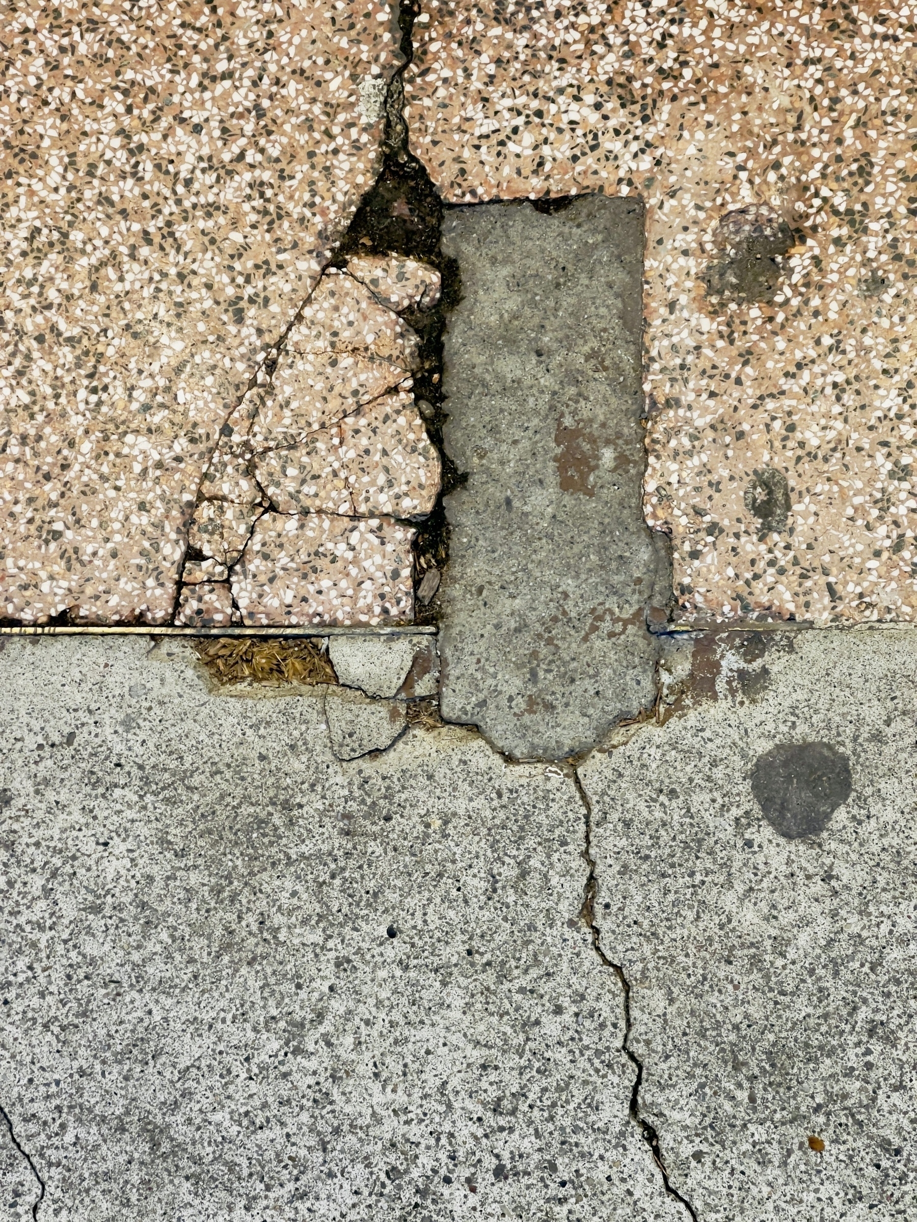 Conjunction of sidewalk texture and shapes in a rectilinear abstract.