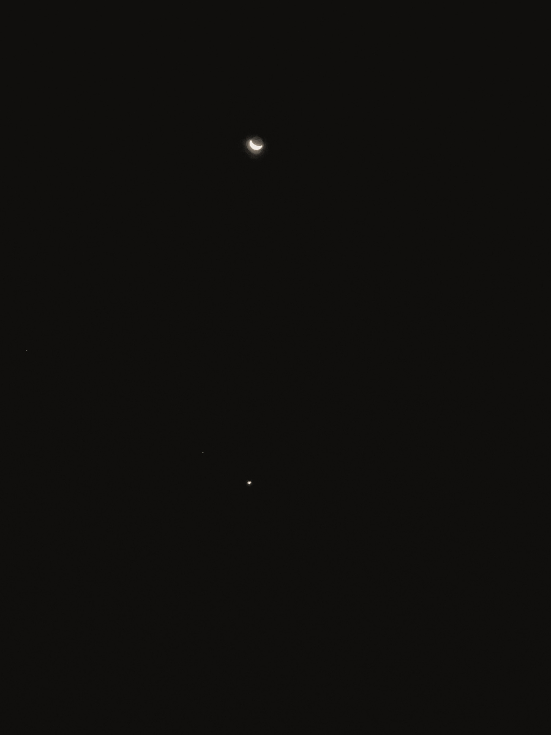 The moon and Venus in the early morning sky.
