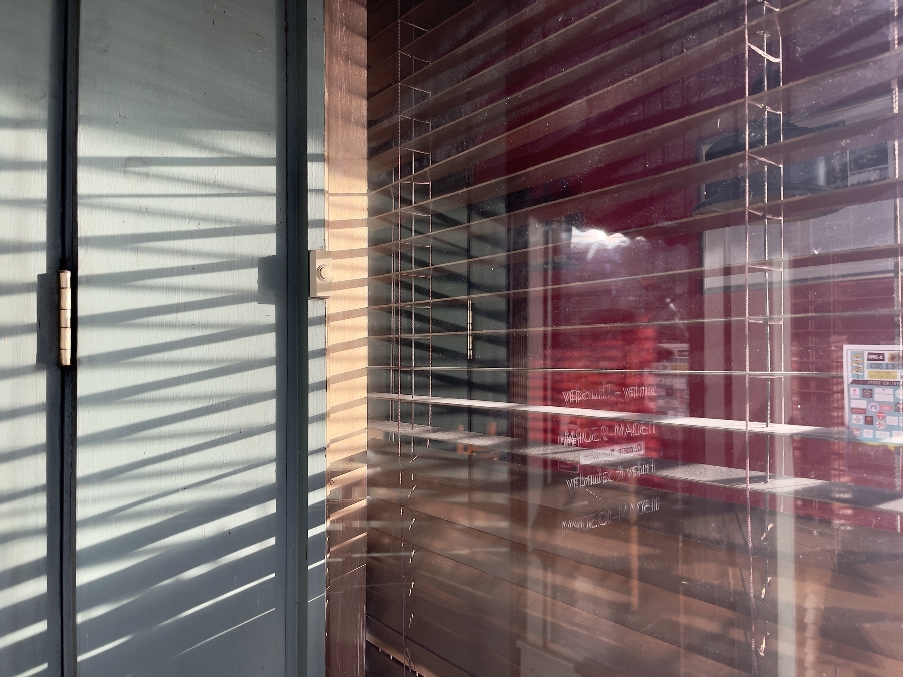 Sunlight through venetian blinds.