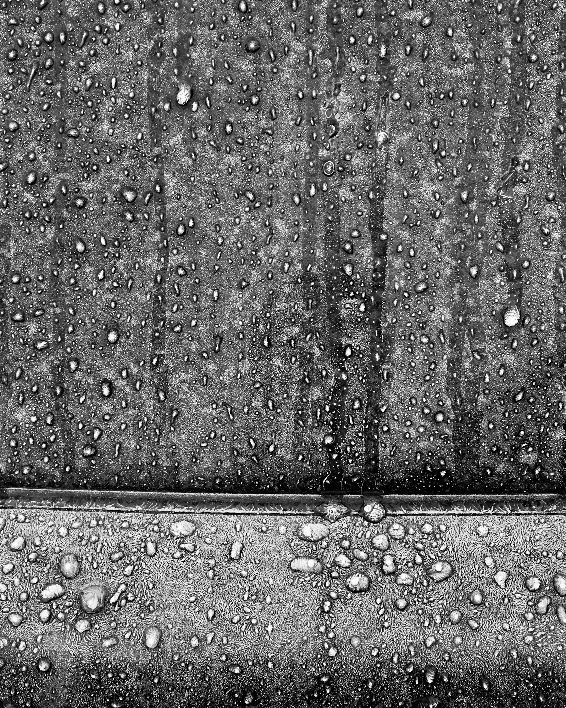 Frozen water droplets on car window.
