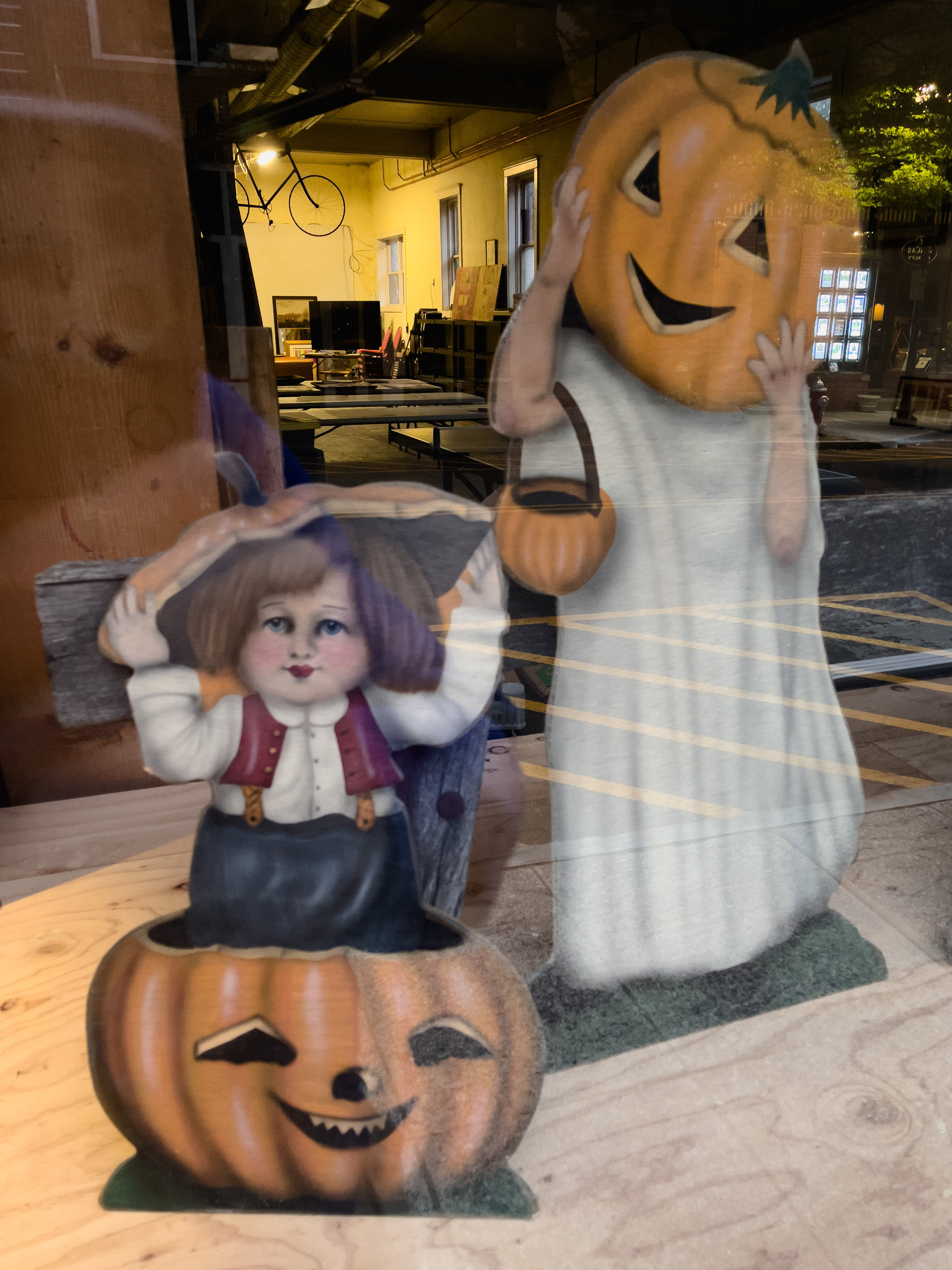Halloween characters in a shop window.