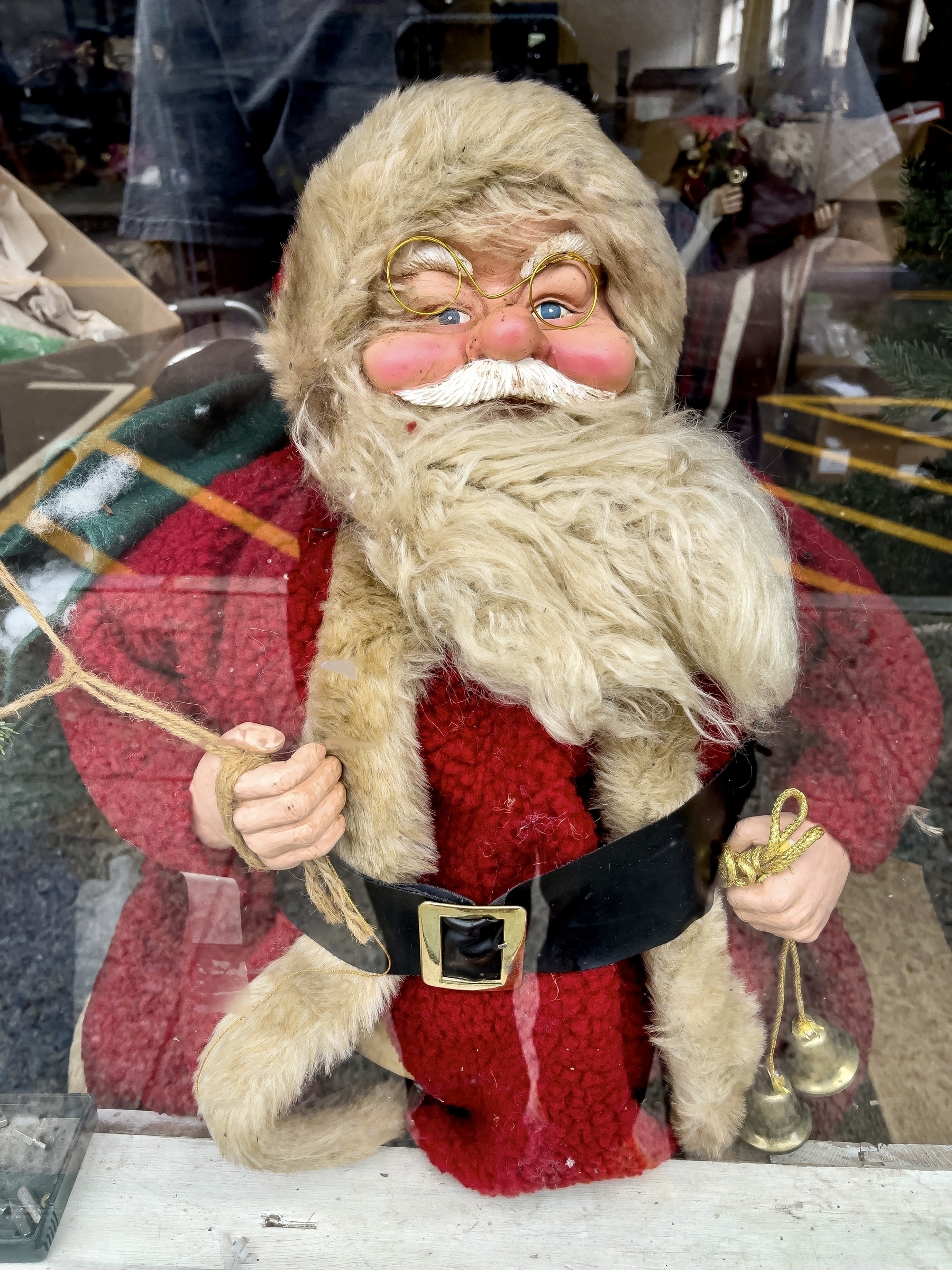 santa clause statue in an estate sales shop window