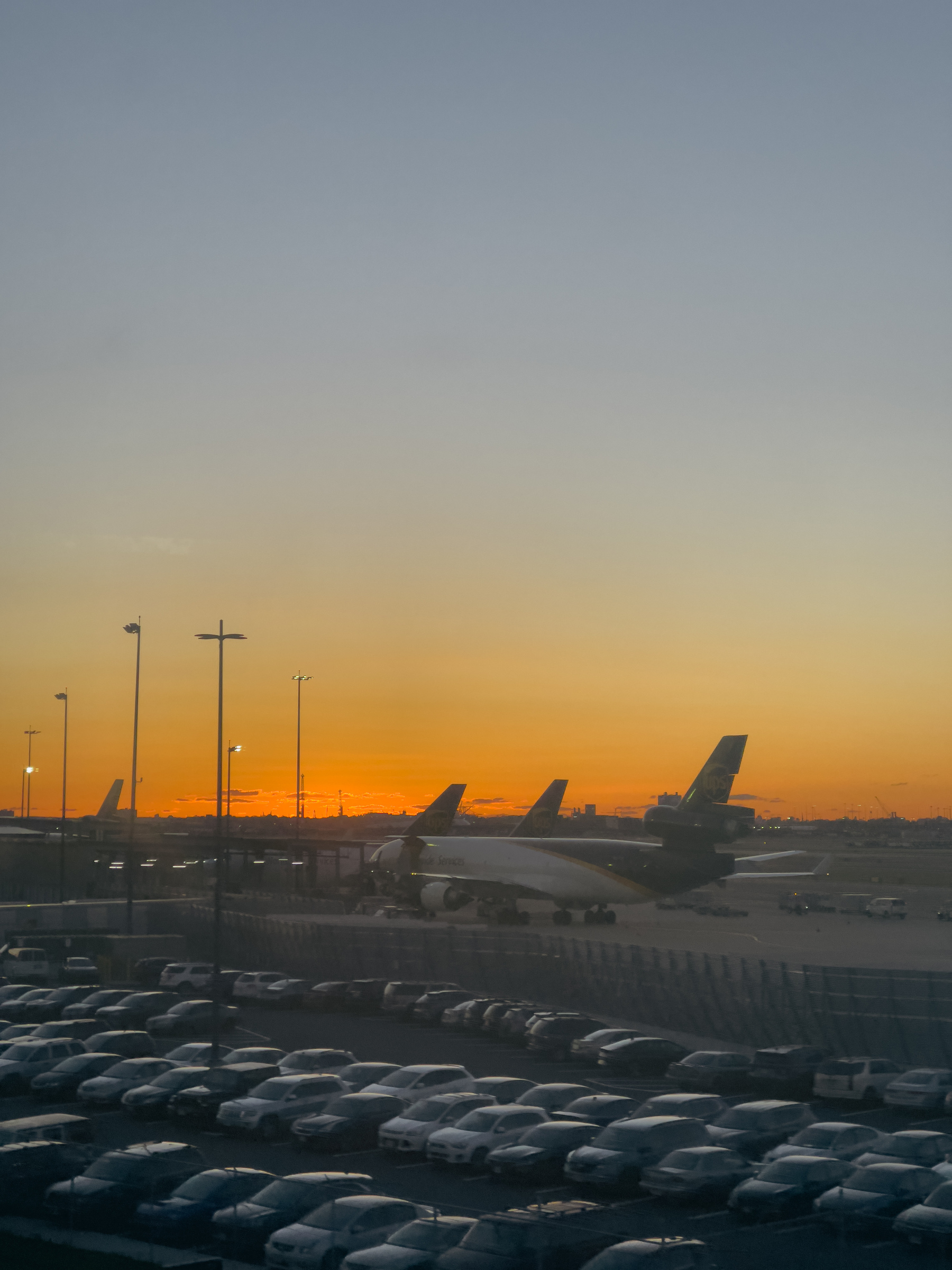 Cars and airplanes at dawn.