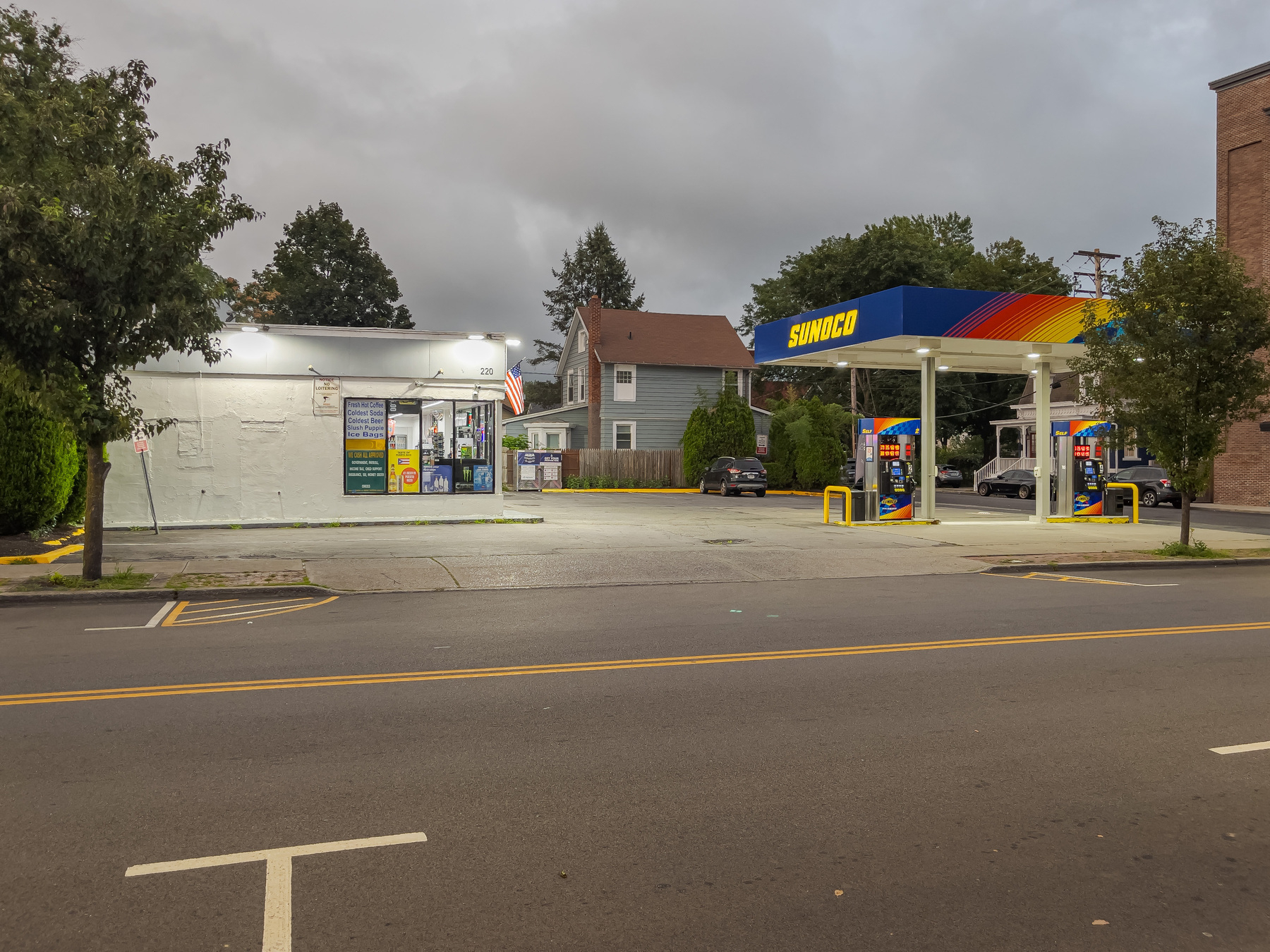 Sunoco gas station on the other side of a street.