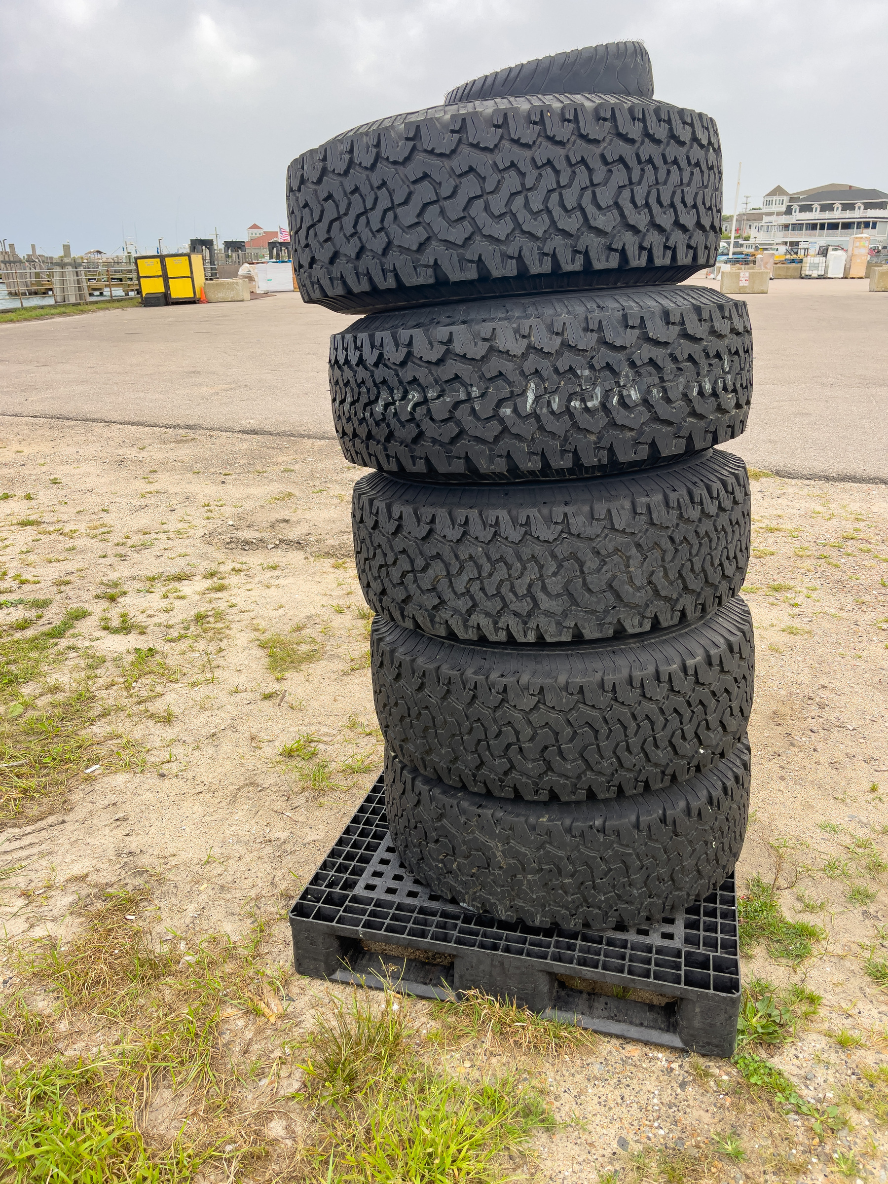Pile of tires on a plastic pallet.