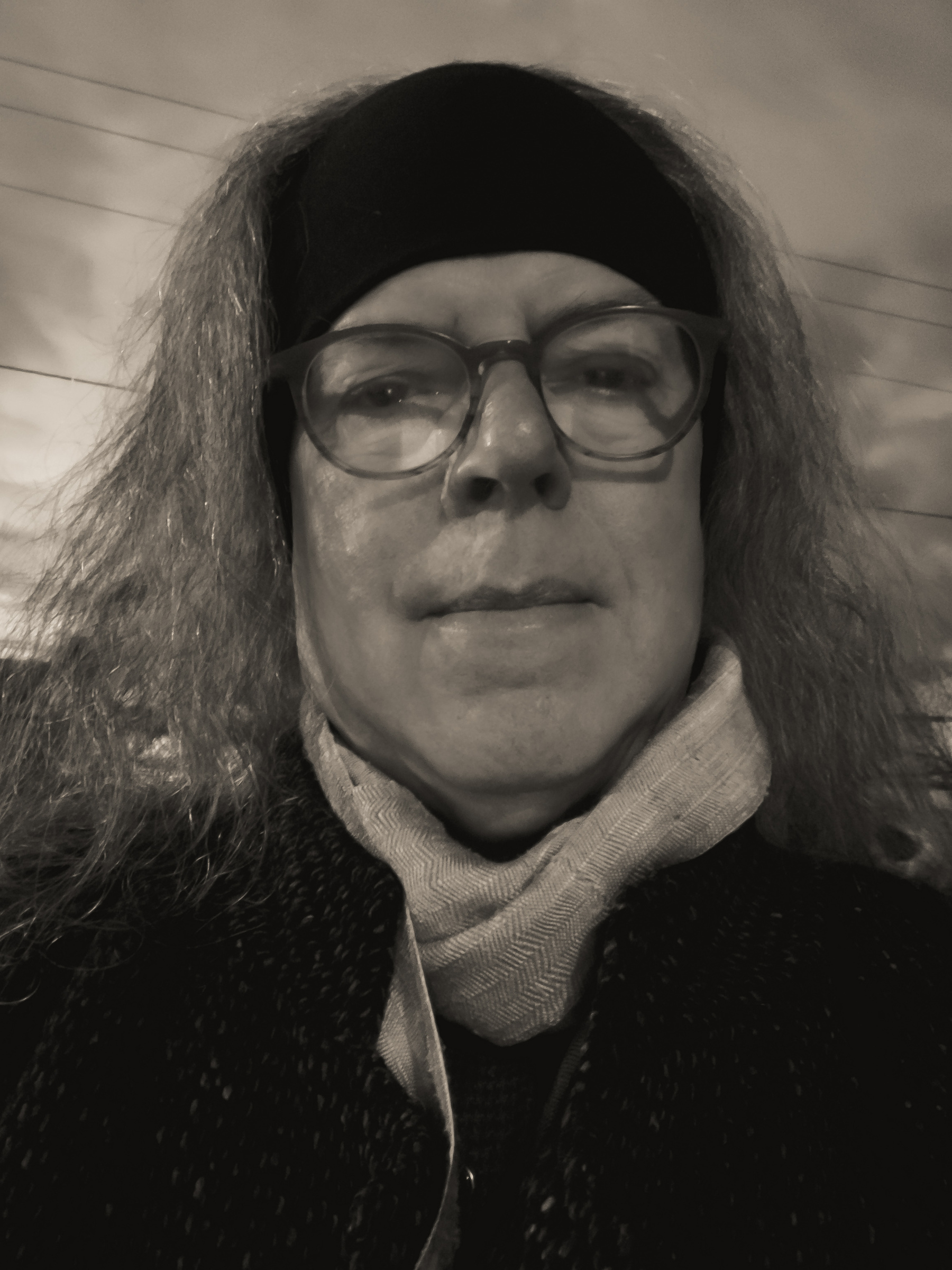 Selfie headshot in warm retro black and white.