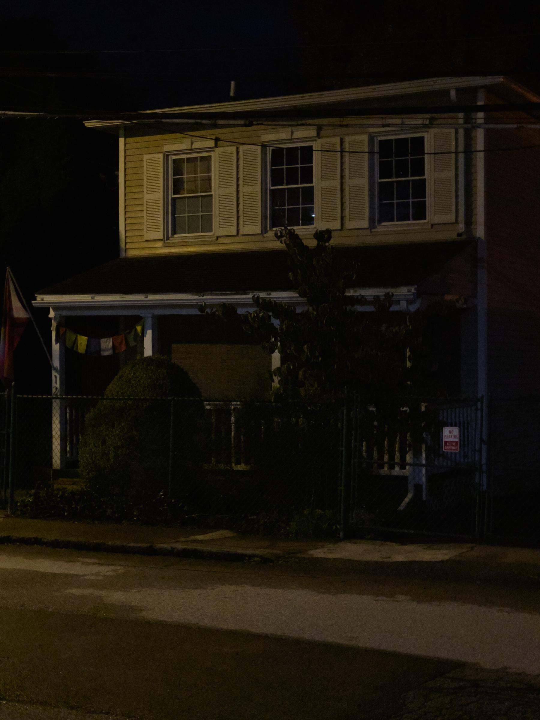 House lit by streetlights.
