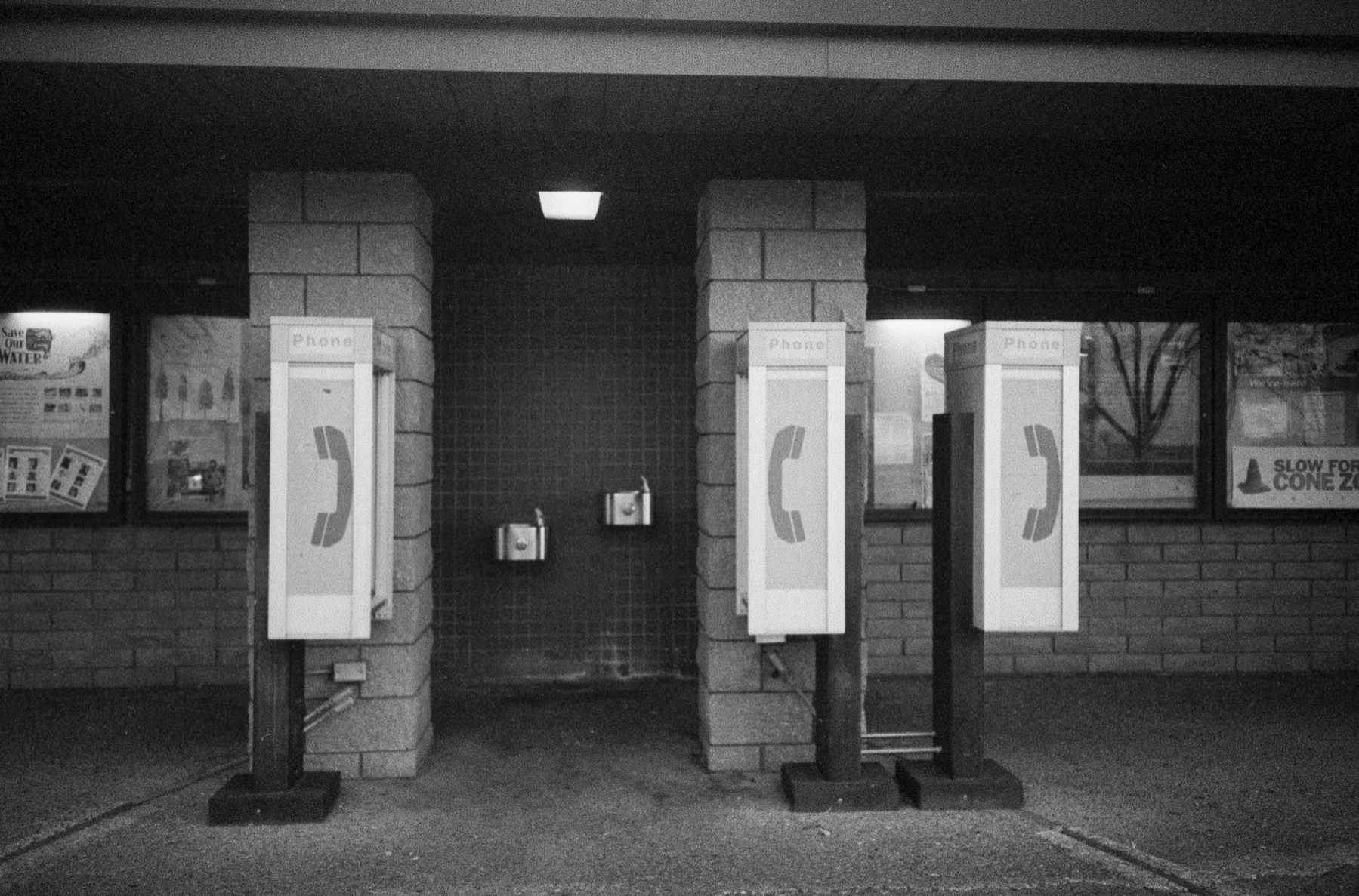 Three pay phones at a rest stop somewhere in Northern California.