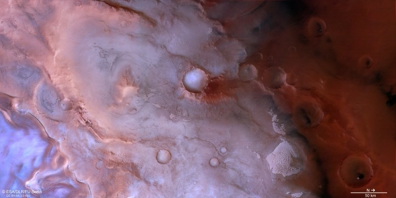 South pole of mars in pink and red.
