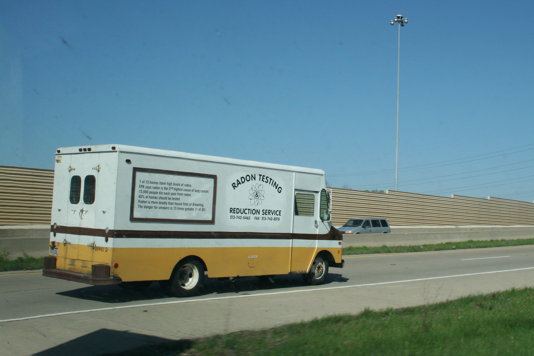 Work van with yellow and brown stripe that reads "1 of 15 homes have high levels of radon.EPA says radon is the 2nd highest cause of lung cancer.15,000 people die each year from radon.40% of homes should be tested.Radon is more deadly than house fires or drowning.The danger for smokers is 15 times greater. (1 of 30)" - Canon 20D