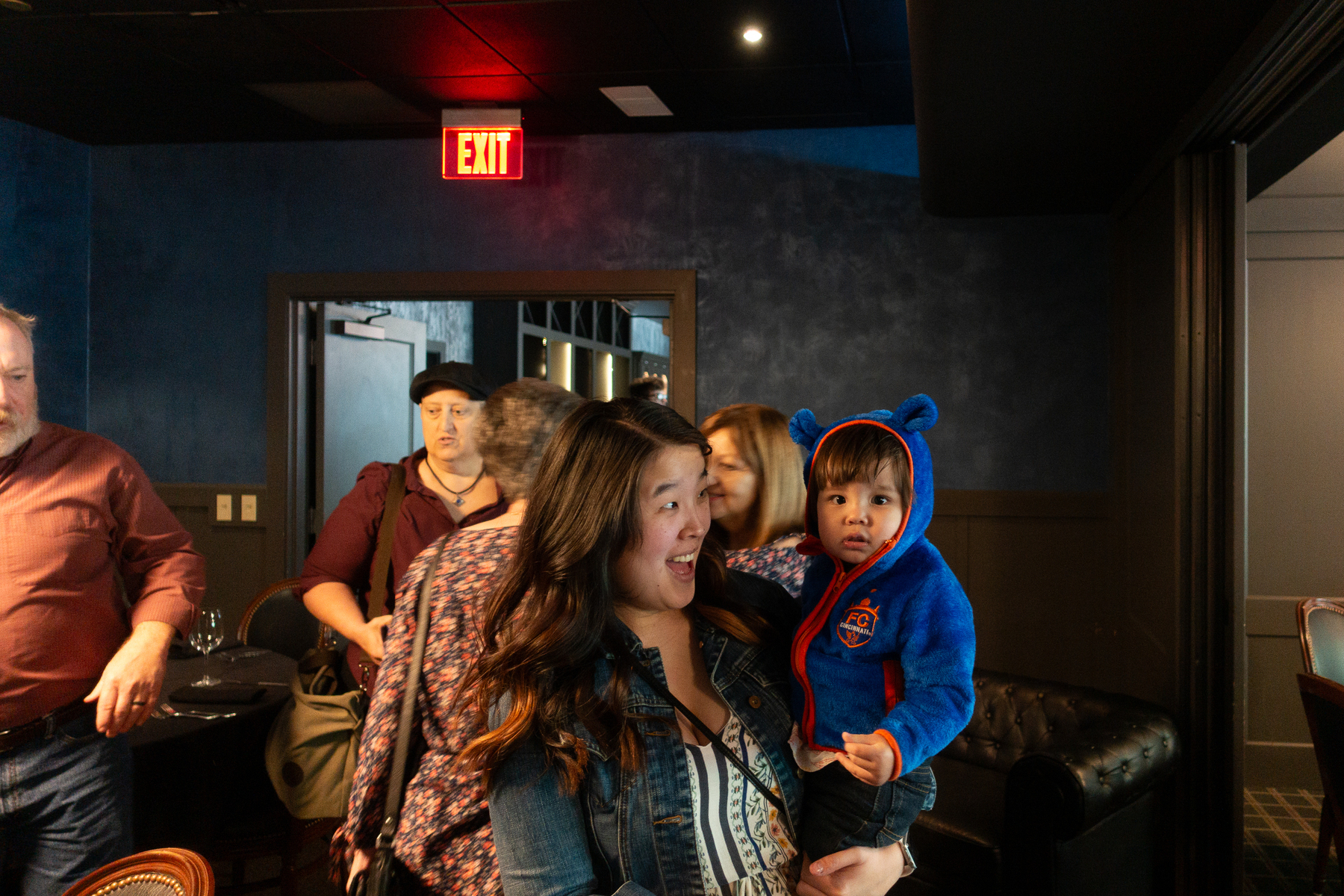 Mom holds toddler and cajoles a smile - Sony RX100