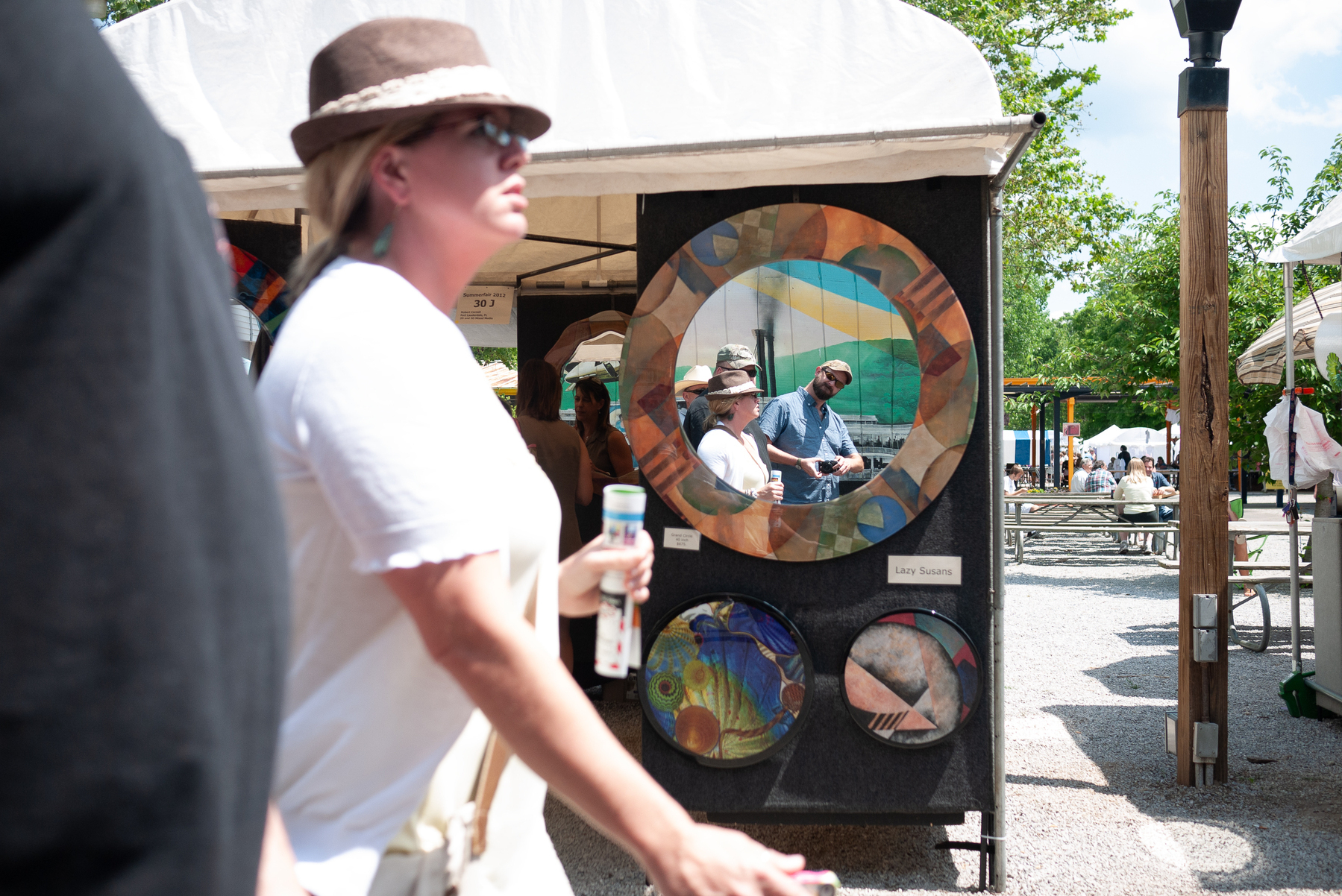 Man takes selfie in mirrored lazy susan at art fair - Lumix GF1