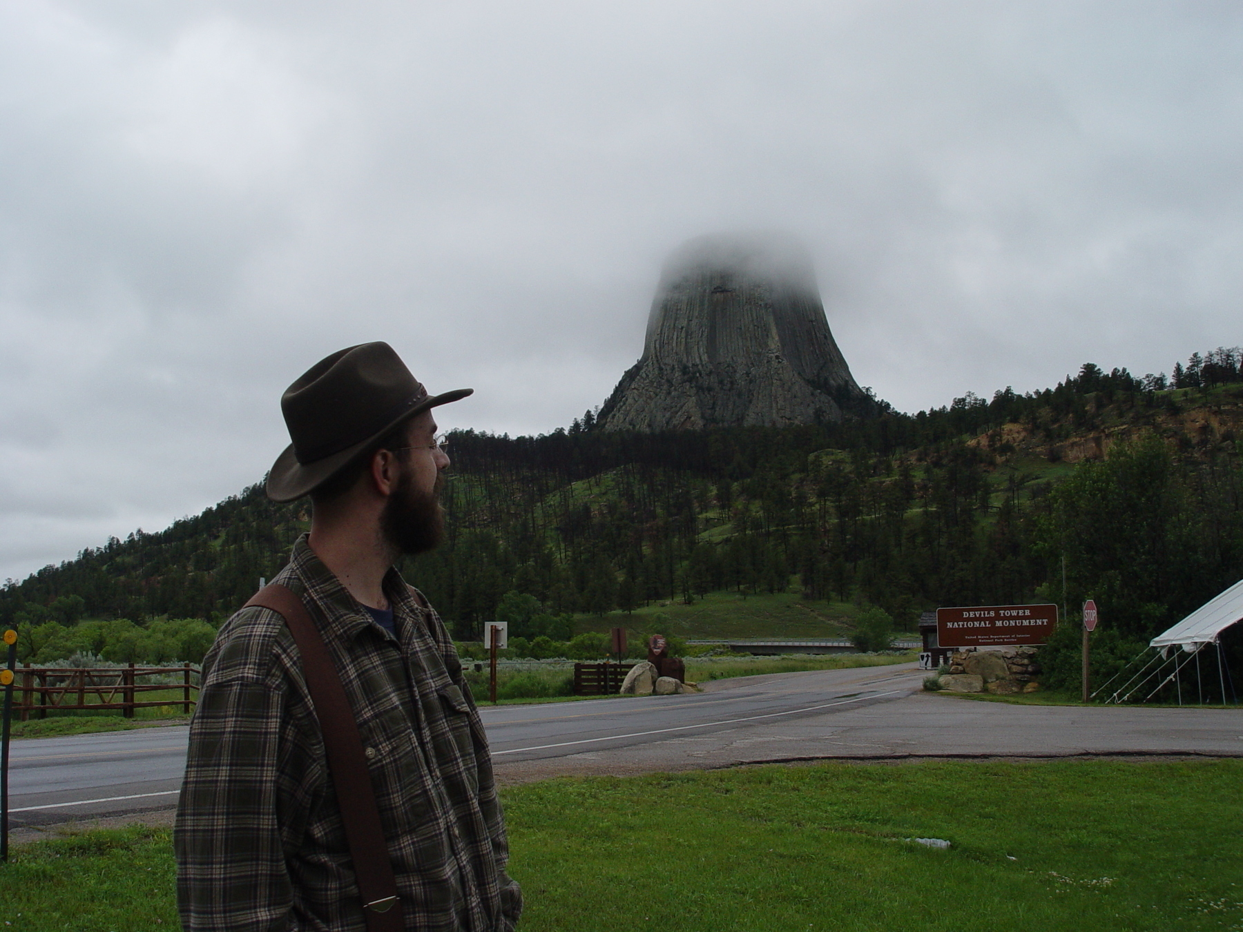 Bearded man in hat looking at Devils Tower - Sony Cybershot