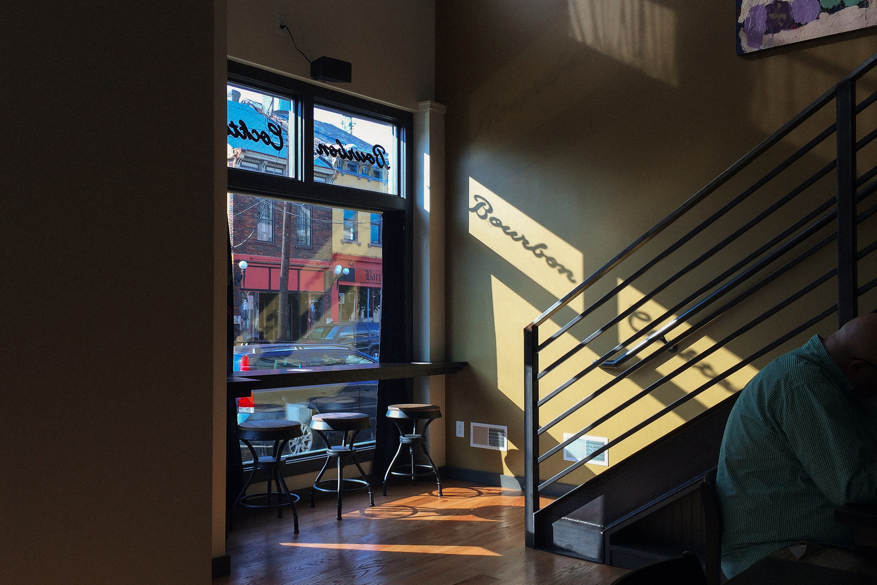 Bourbon sign in window casts shadow in restaurant - iPhone 5S