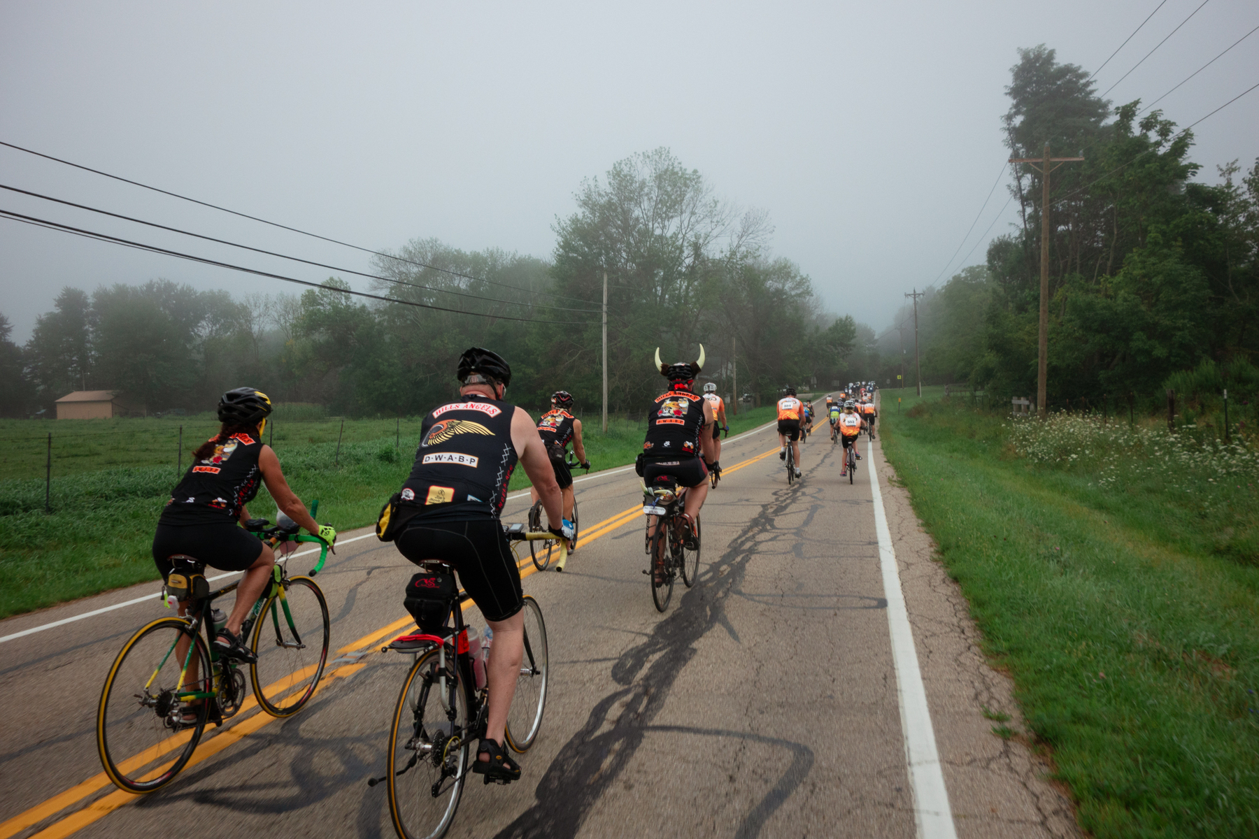 Road bike riders on a foggy morning - Sony RX100