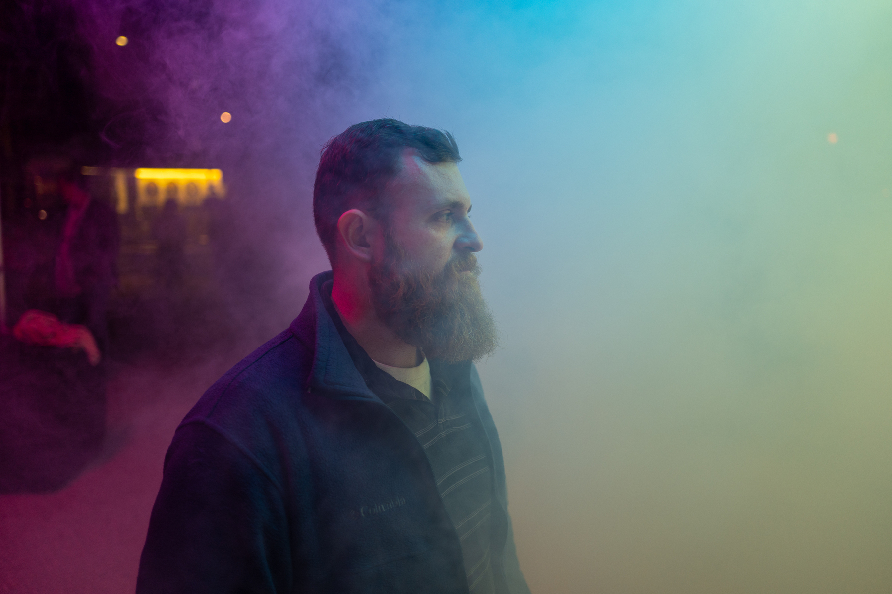 Bearded man in profile in a fake fog and colored lighting - Leica Q