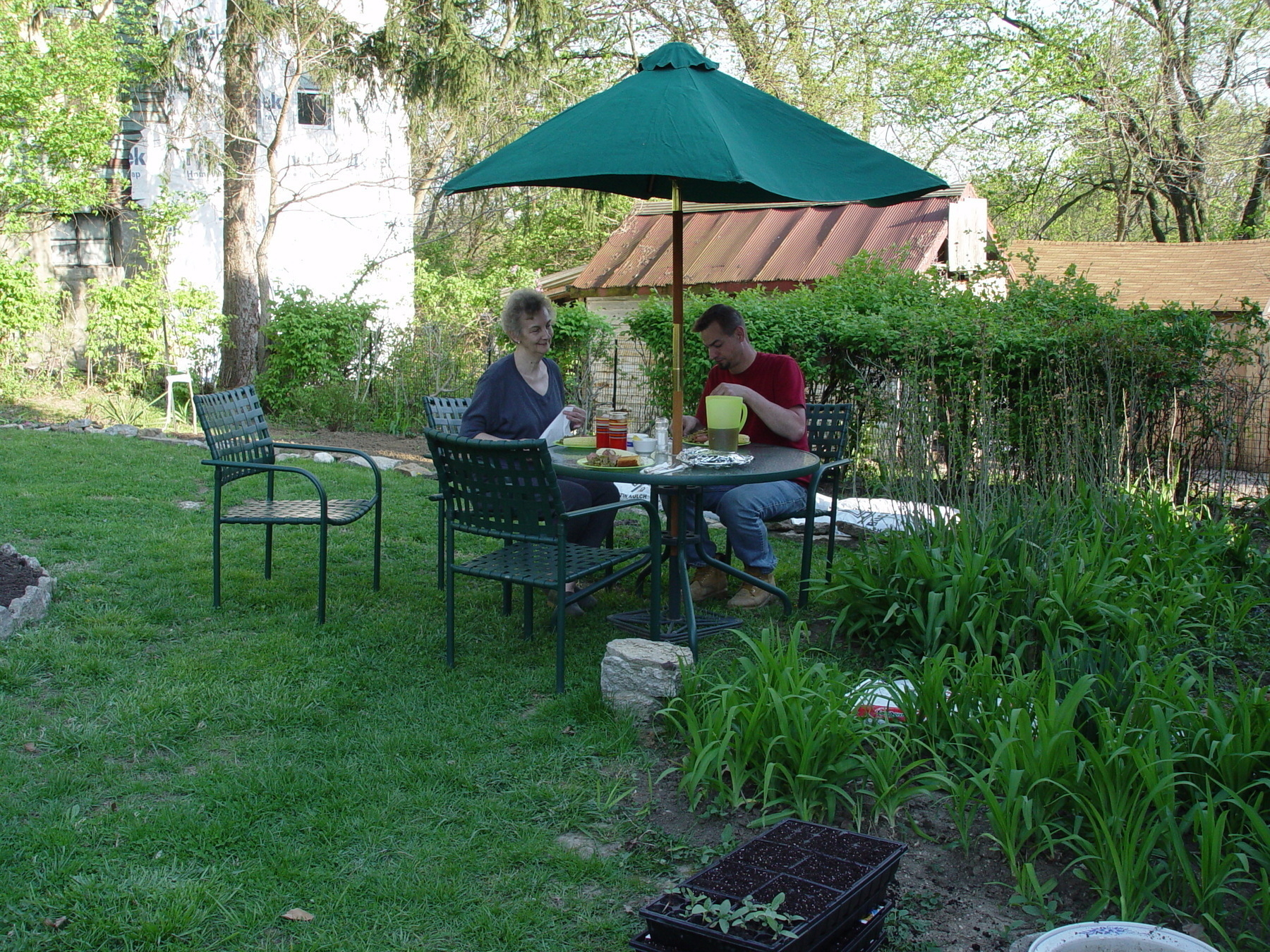 Backyard table with family and meal - Sony Cybershot