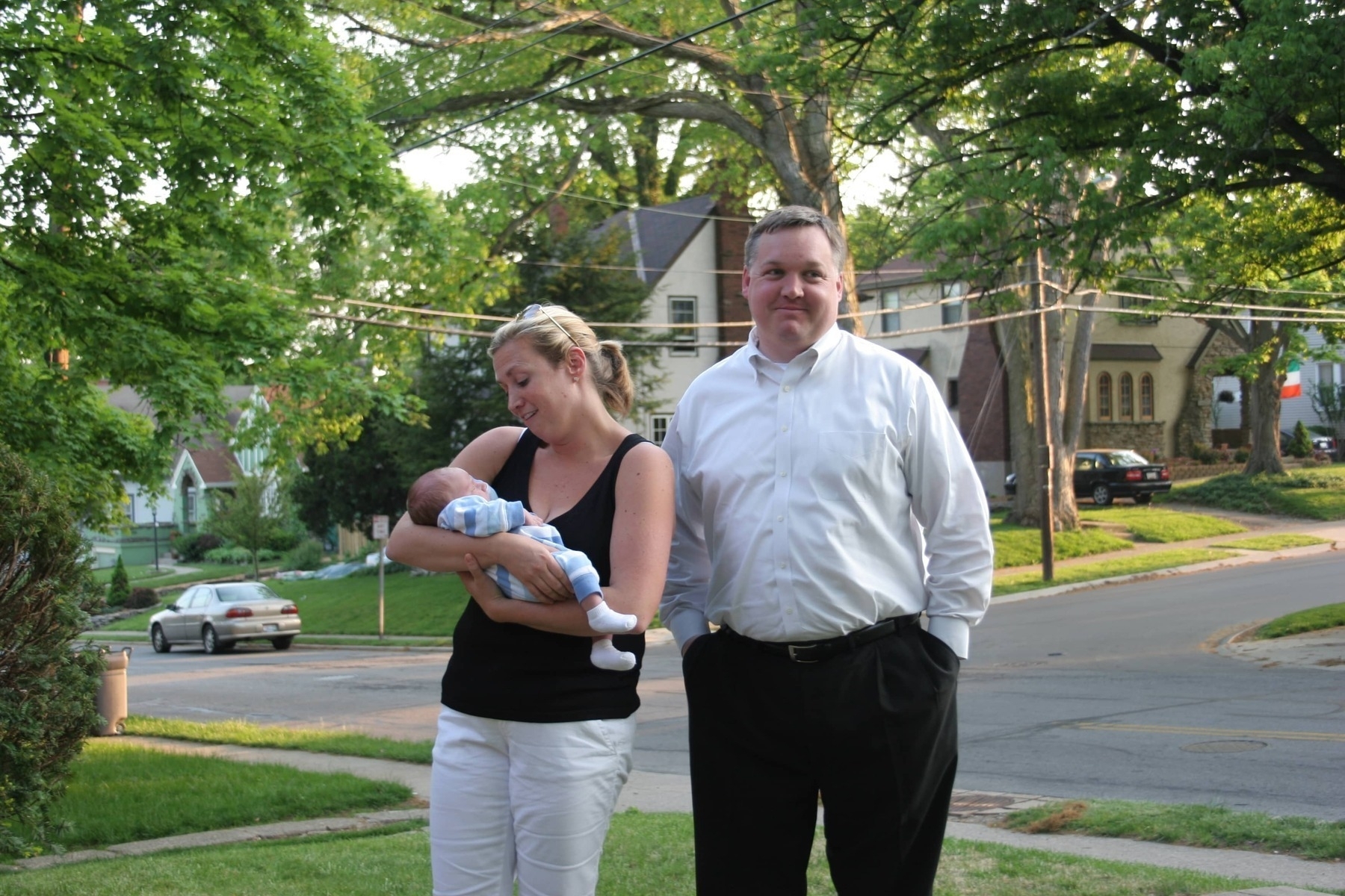 Woman holds baby next to husband. It is not their baby. - Canon 20D